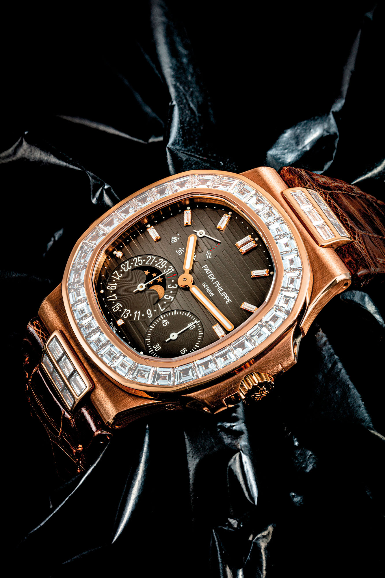 PATEK PHILIPPE. AN IMPRESSIVE 18K PINK GOLD AND BAGUETTE CUT