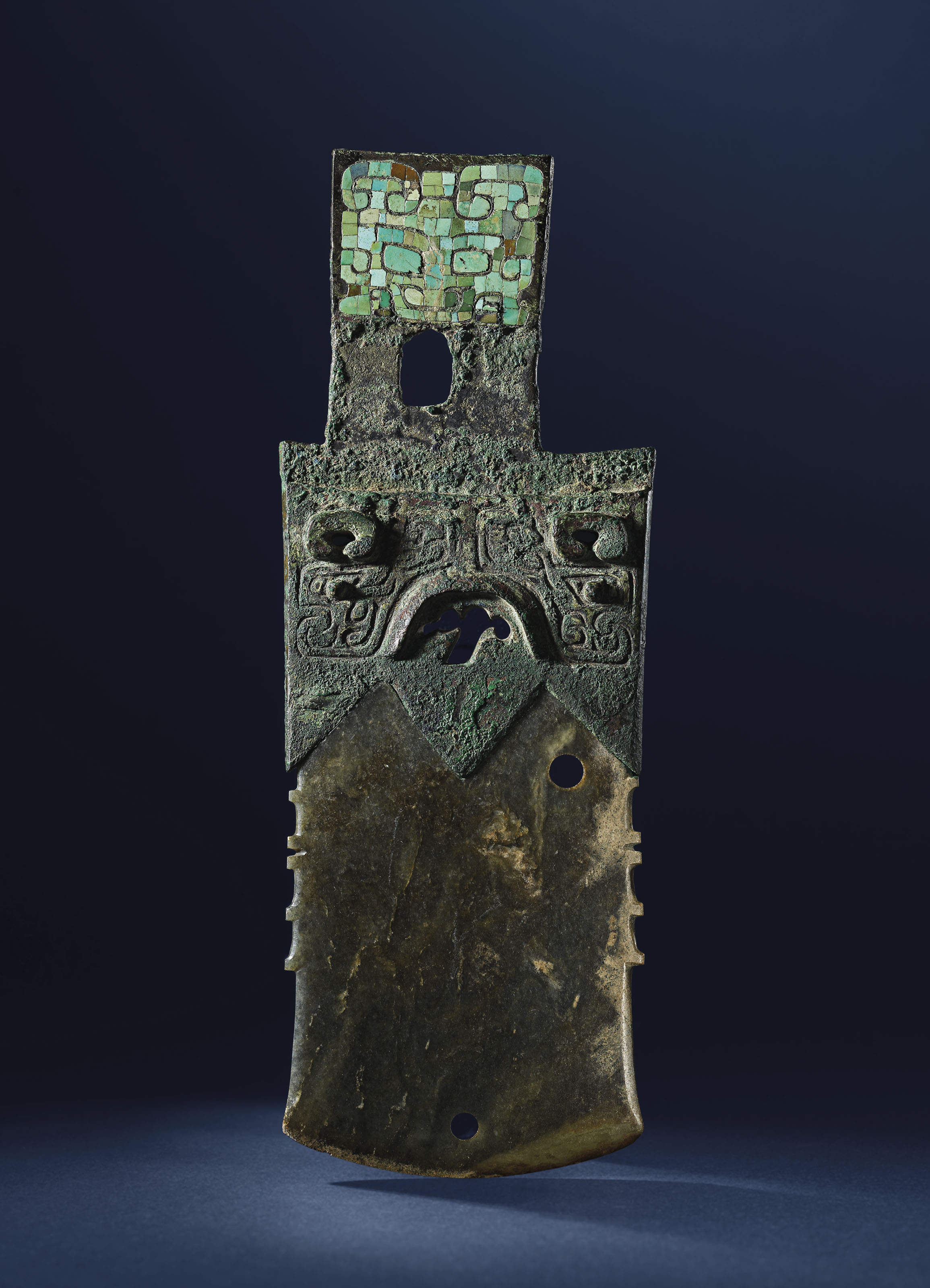 An important and very rare turquoise-inlaid and jade-inset bronze axe, qi, Shang Dynasty (c.1600-1046 BC). 21 cm (8⅛&nbsp;in) long. Sold for HK$6,250,000 on 20 November 2020 at Christie&rsquo;s in Hong Kong