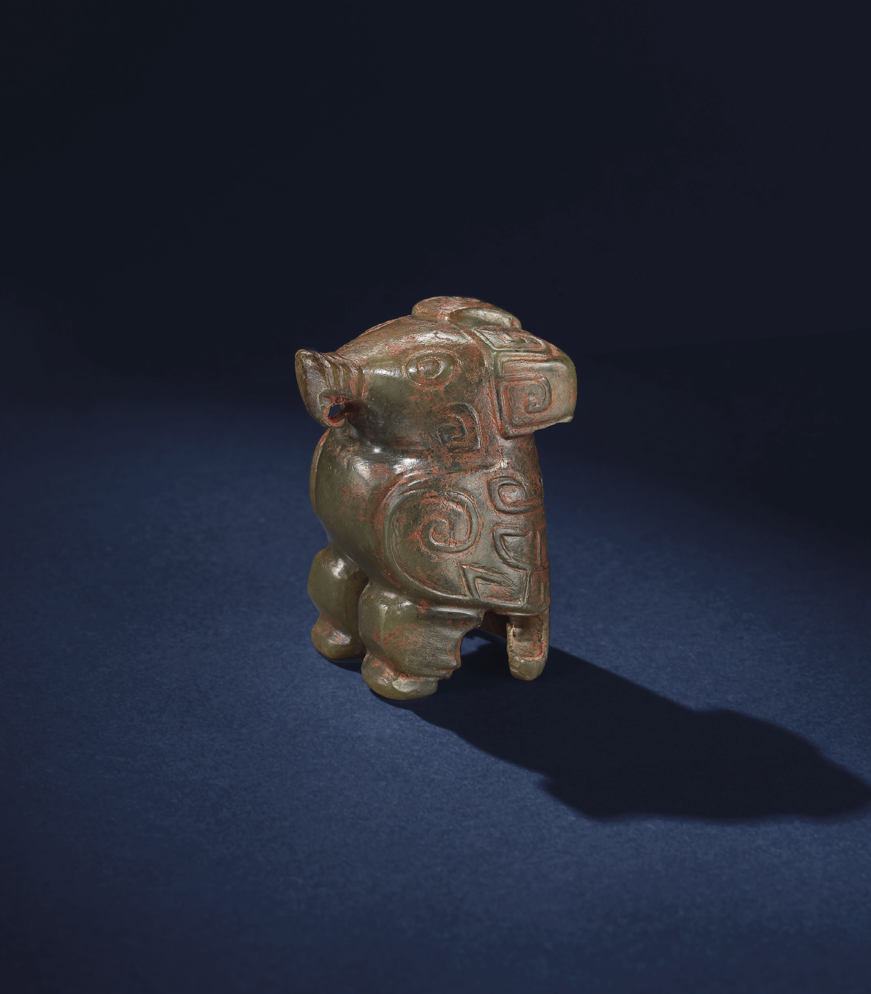 A CELADON JADE CARVING OF AN OWL , SHANG DYNASTY, C. 16001046 BC