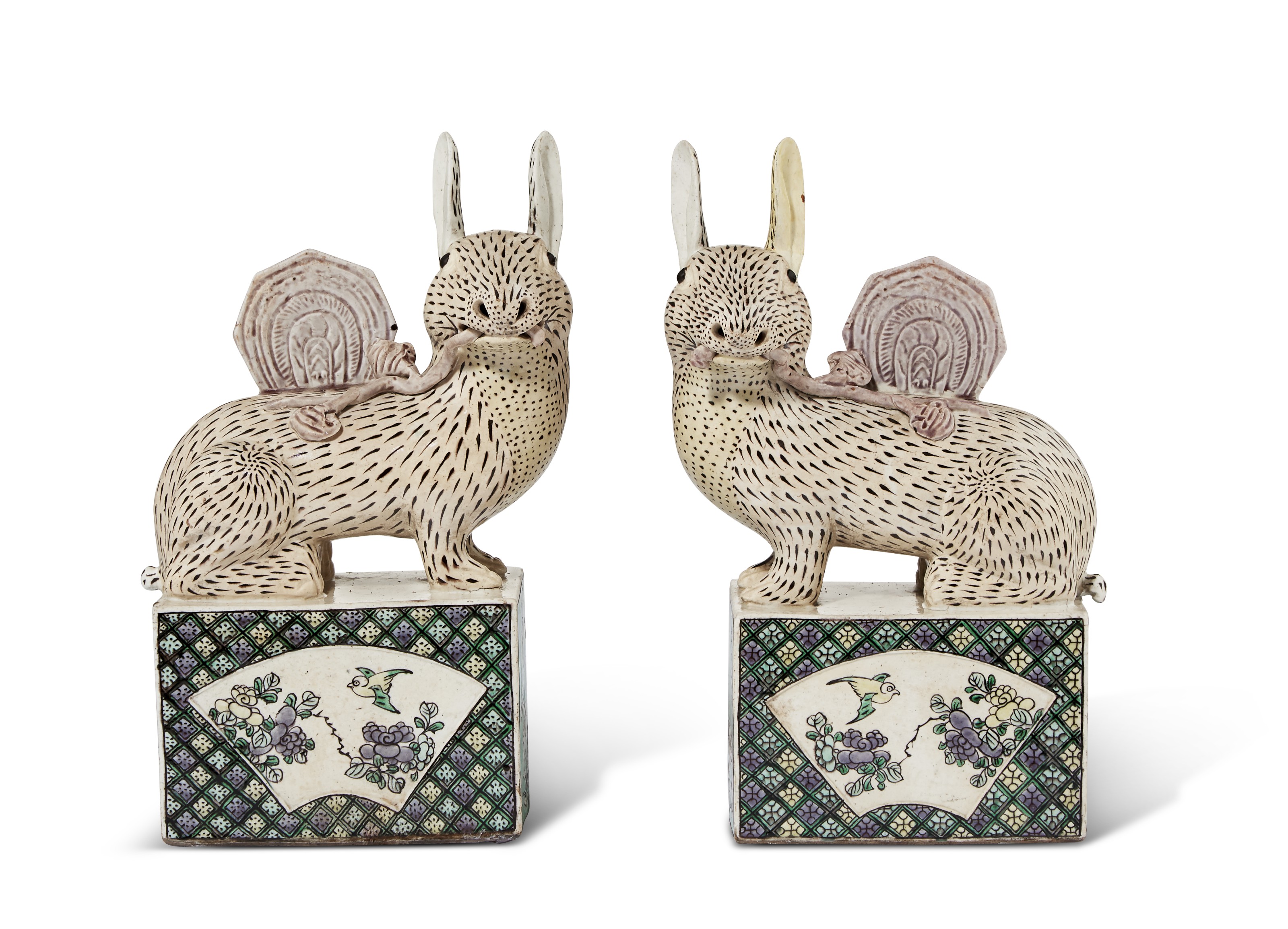 A PAIR OF CHINESE EXPORT BISCUIT GLAZED PORCELAIN RABBITS, QING DYNASTY ...