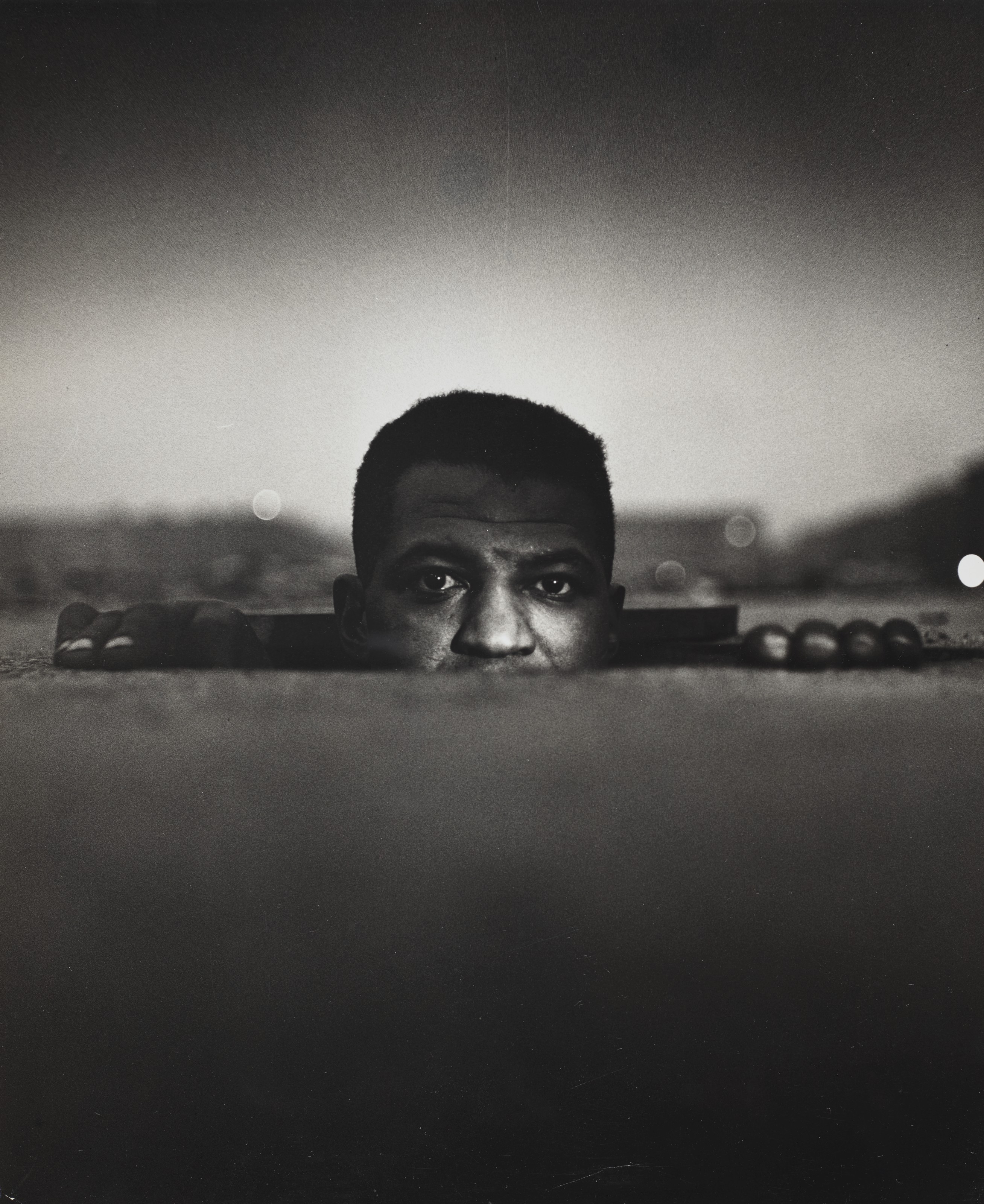 Gordon Parks (1912-2006), Emerging Man, Harlem, New York (from Invisible Man), 1952. Image/sheet: 12⅝ x 10⅞ in (32 x 27.6 cm). Estimate: $10,000-15,000. Offered in Photographs, 19 May-3 June 2020, Online