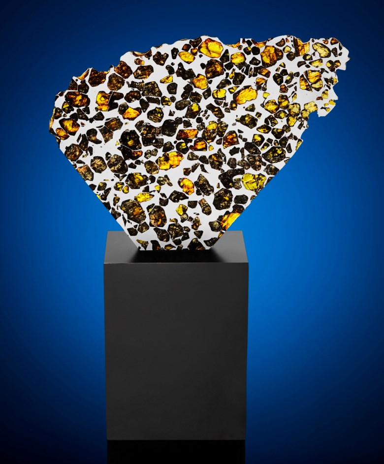 Extraterrestrial gems in a large partial slice of Esquel pallasite, Argentina. 163 x 207 x 3 mm (6.33 x 8 x 0.1 in). Estimate $15,000-25,000. Offered in
Deep Impact Lunar and Rare Meteorites, 12-25 August 2020, Online