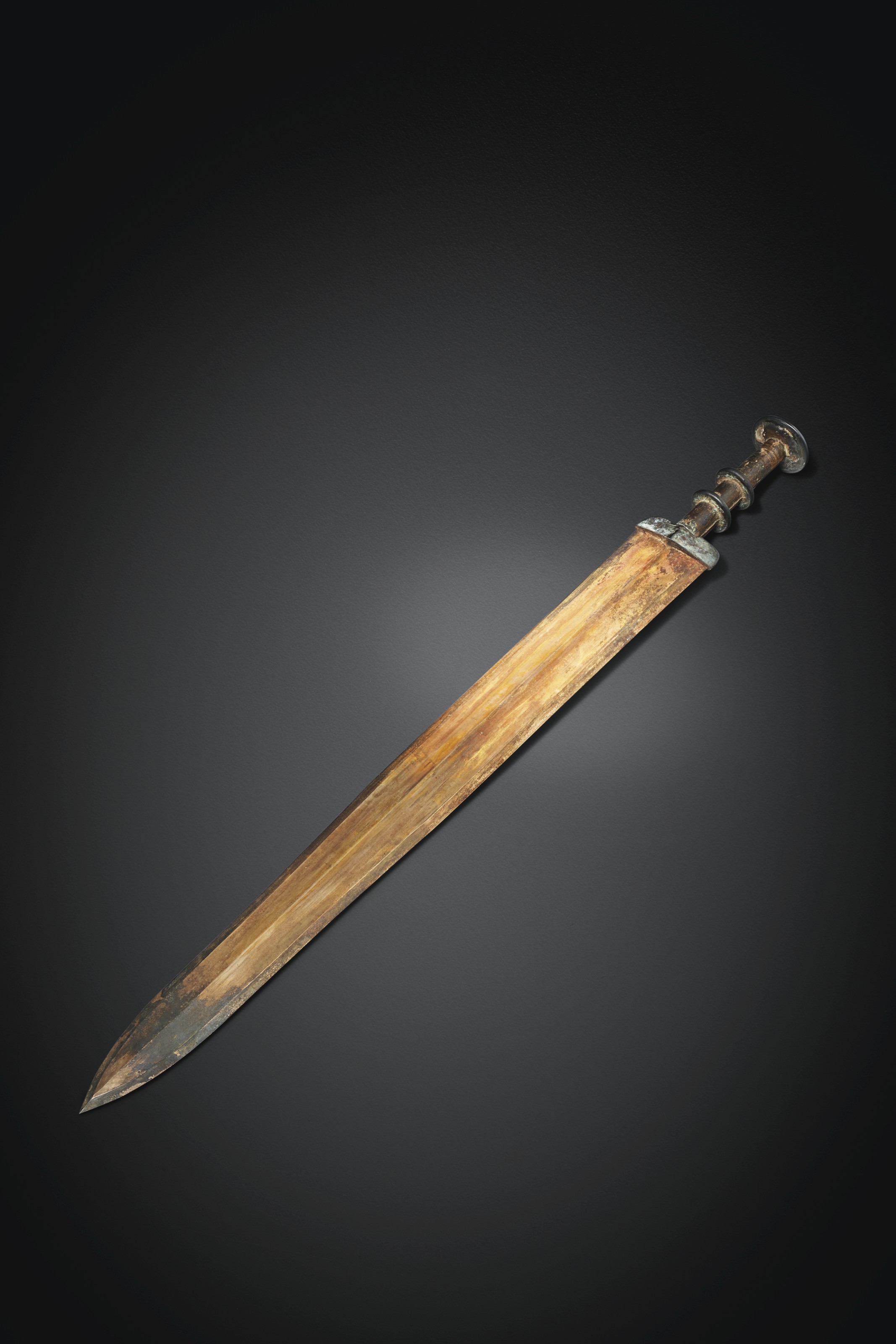 A PARCELGILT BRONZE SWORD