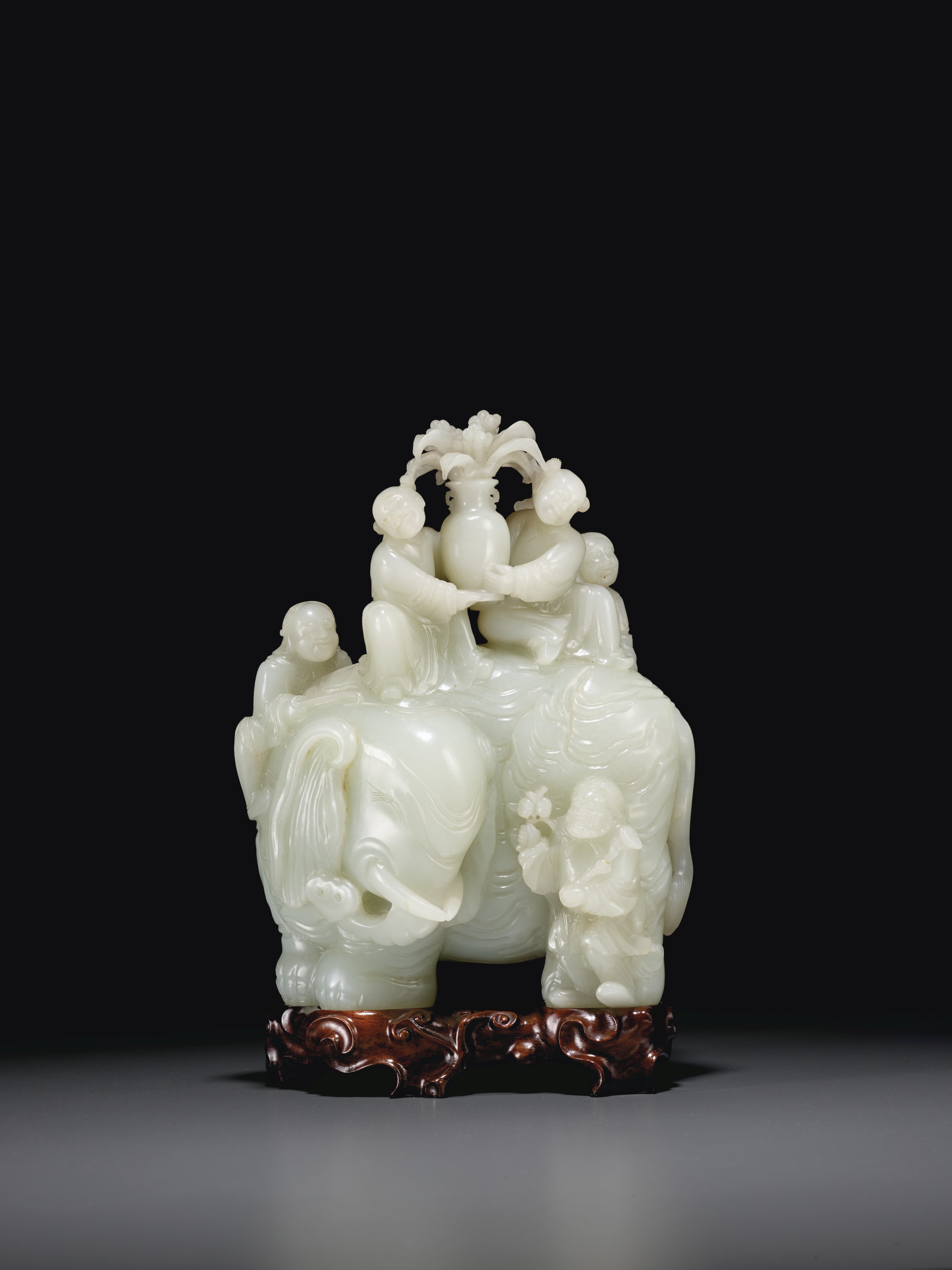 A large and finely carved white jade &lsquo;elephant and boys&rsquo; group, Qianlong period (1736-1795). 7&frac12; in (19 cm) high. Sold for $1,014,000 on 25 September 2020 at Christie’s in New York