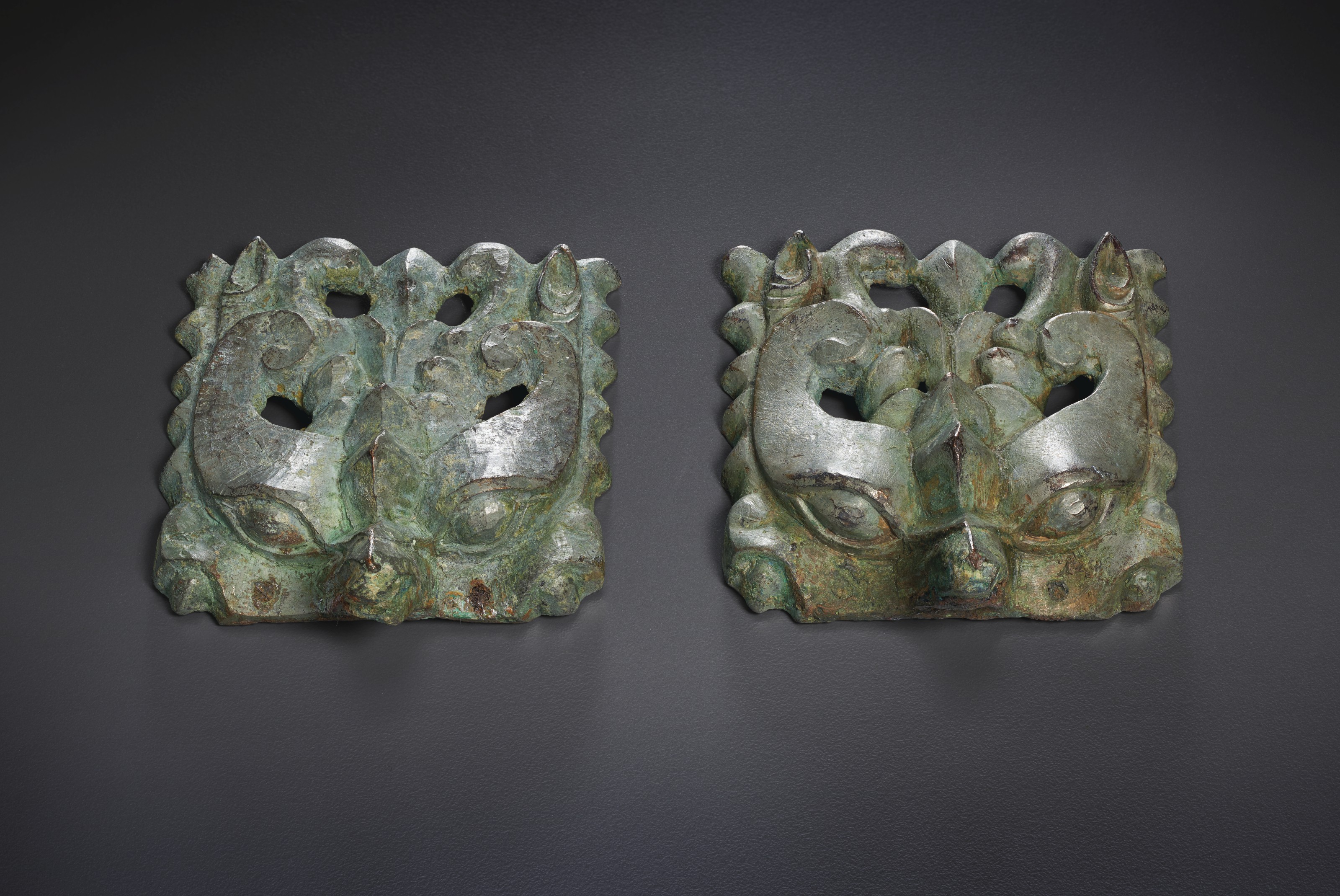 A PAIR OF BRONZE TAOTIE MASKS