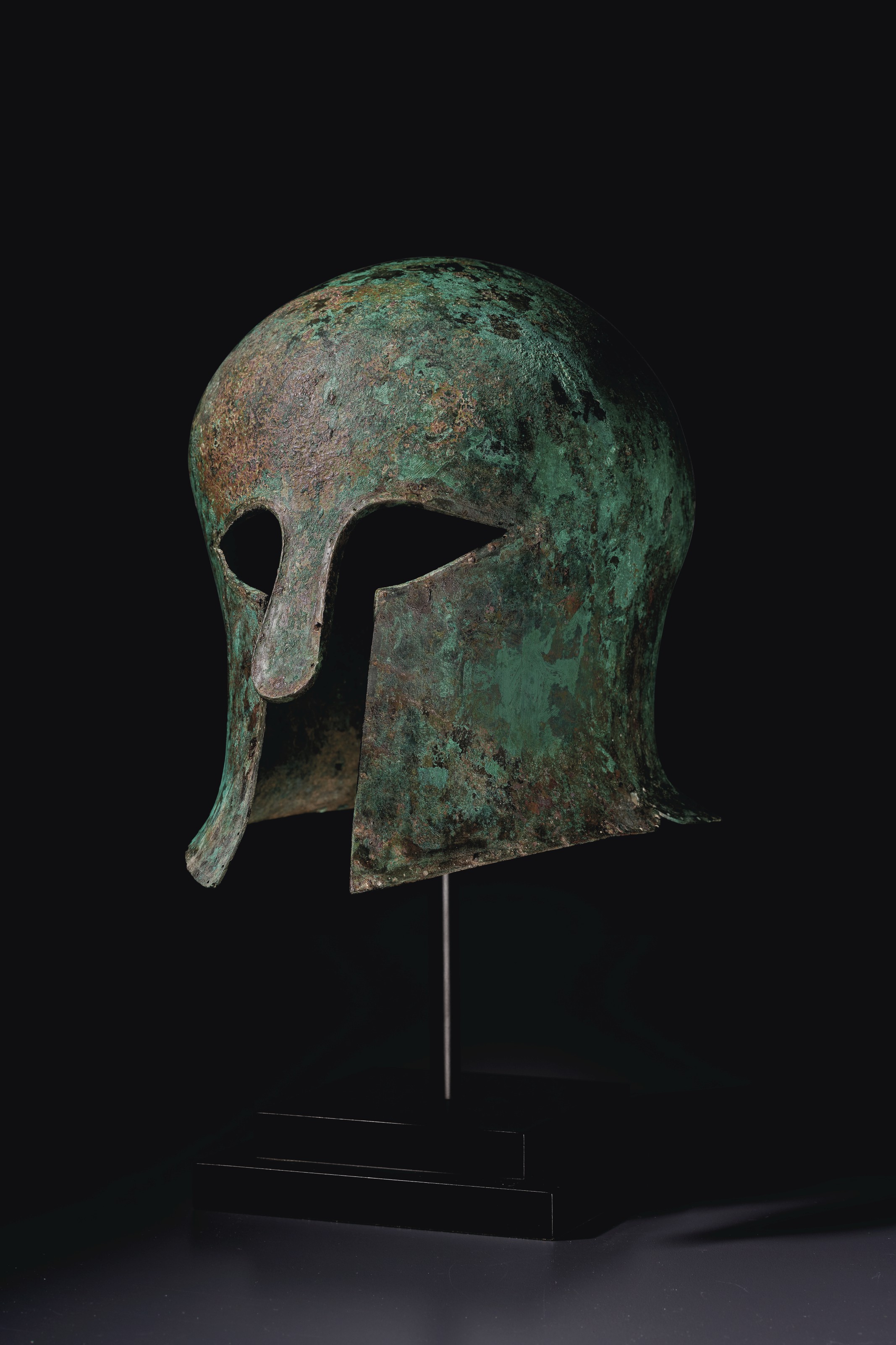 A Greek bronze helmet of Corinthian type, Archaic period, circa mid 6th century BC, sold for $350,000 on 12 October 2020 at Christie's in New York