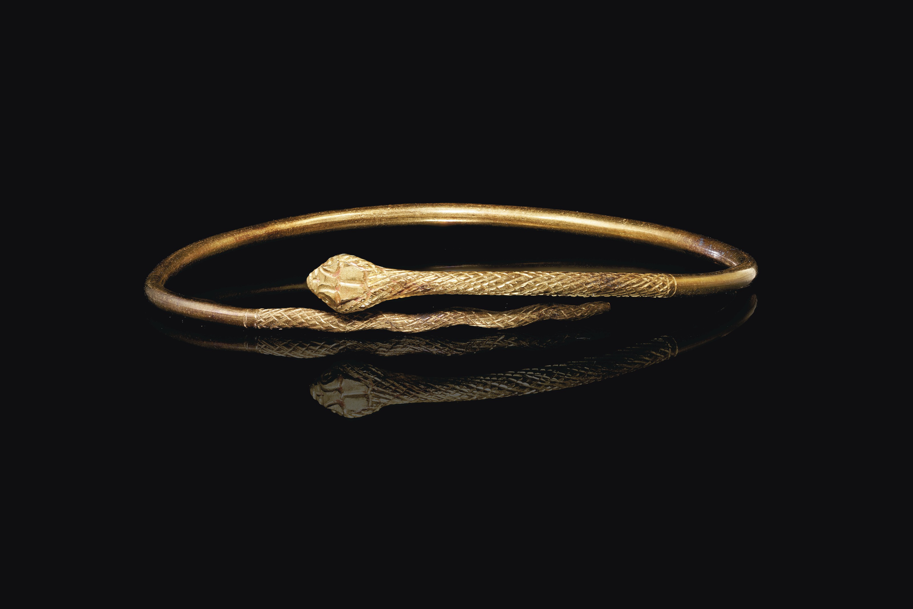 AN EGYPTIAN GOLD SNAKE BRACELET , PTOLEMAIC TO ROMAN PERIOD, CIRCA 2ND
