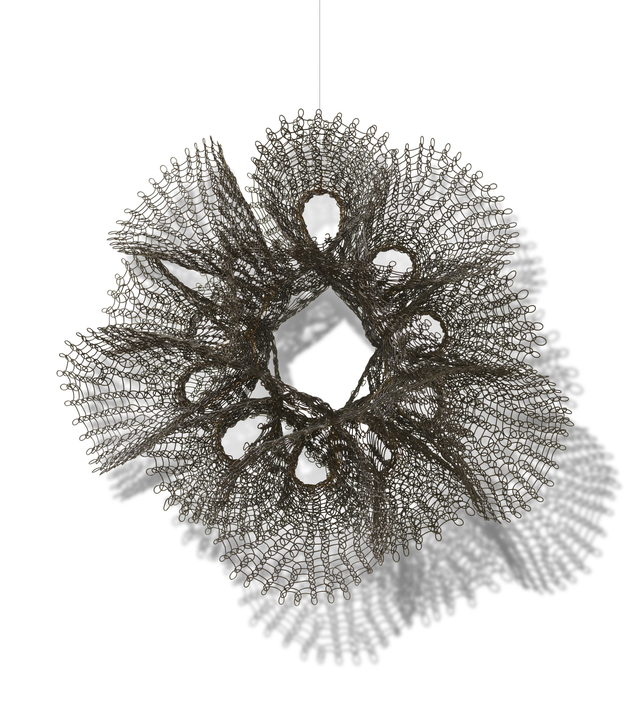 Ruth Asawa (1926-2013), Untitled (S.753, Hanging Ten Interlocking Double Trumpets), circa early-1960s. Brass and copper wire. 23 x 24 x 14&frac12;  in (58.4 x 61 x 36.8  cm). Sold for $1,050,000&nbsp;on 7 October 2020 at Christie&rsquo;s in New York. Artwork: &copy;
The Estate of Ruth Asawa / DACS, London