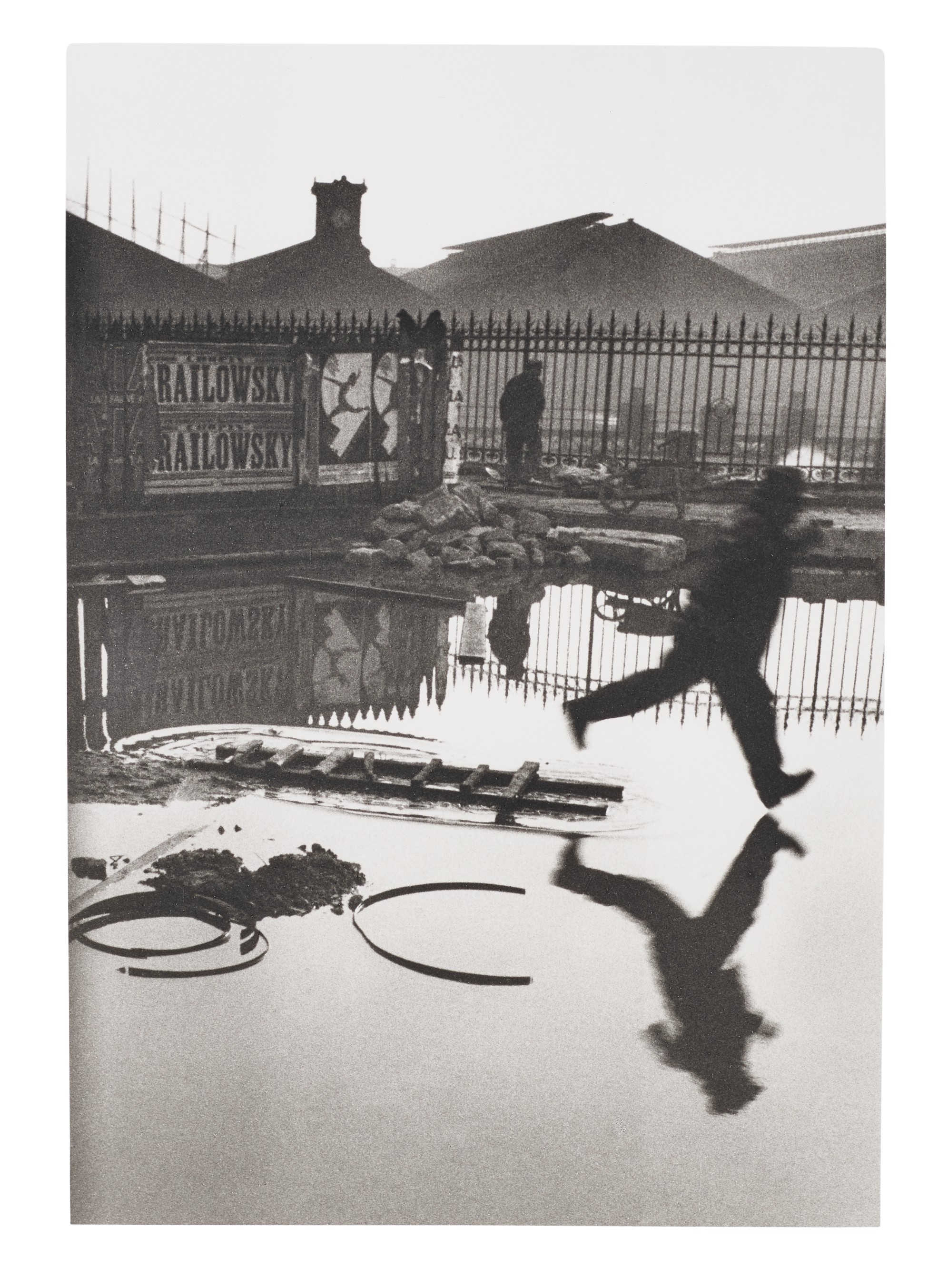 Henri Cartier&ndash;Bresson (1908&ndash;2004), Behind the Gare St. Lazare, Paris, 1932. Gelatin silver print, printed later. Sheet: 16 x 12 in (40.6 x 30.4 cm). Estimate: $10,000-15,000. Offered in 
Photographs, 21-30 September 2020, Online