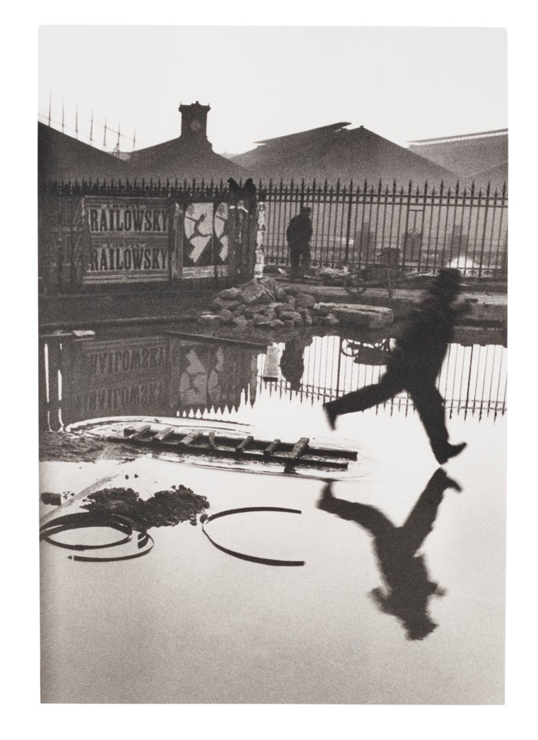 Henri Cartier–Bresson (1908–2004), Behind the Gare St. Lazare, Paris, 1932. Gelatin silver print, printed later. Sheet 16 x 12 in (40.6 x 30.4 cm). Estimate $10,000-15,000. Offered in 
Photographs, 21-30 September 2020, Online