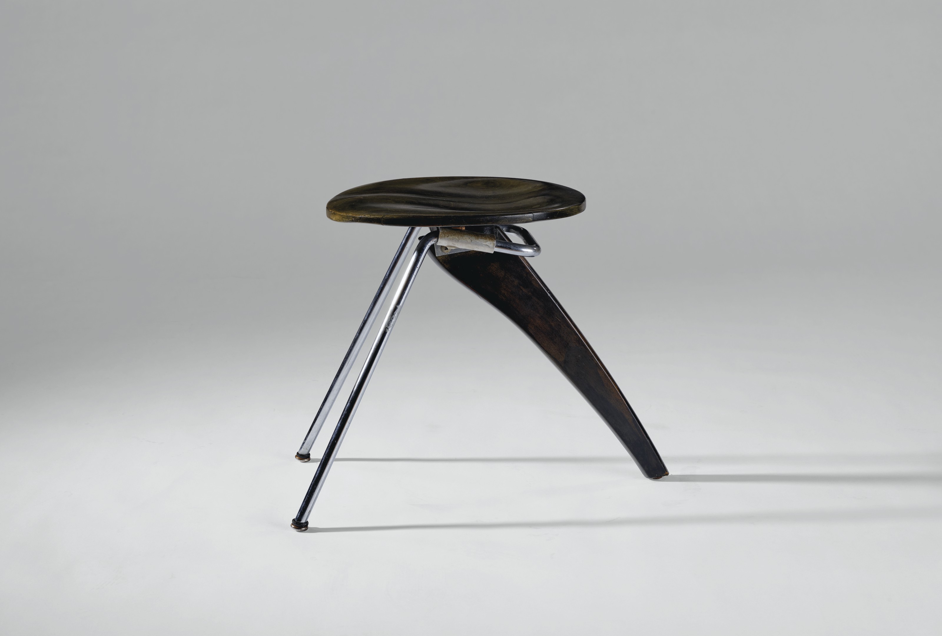 Isamu Noguchi (1904-1988), rare &lsquo;Rudder&rsquo; stool, model no. in-22, circa 1950. 16&frac34;  in (42.5 cm) high; 14  in (35.5 cm) wide; 22  in (55.8 cm) deep. Sold for $30,000 in Design on 11 December 2020 at Christie&rsquo;s in New York