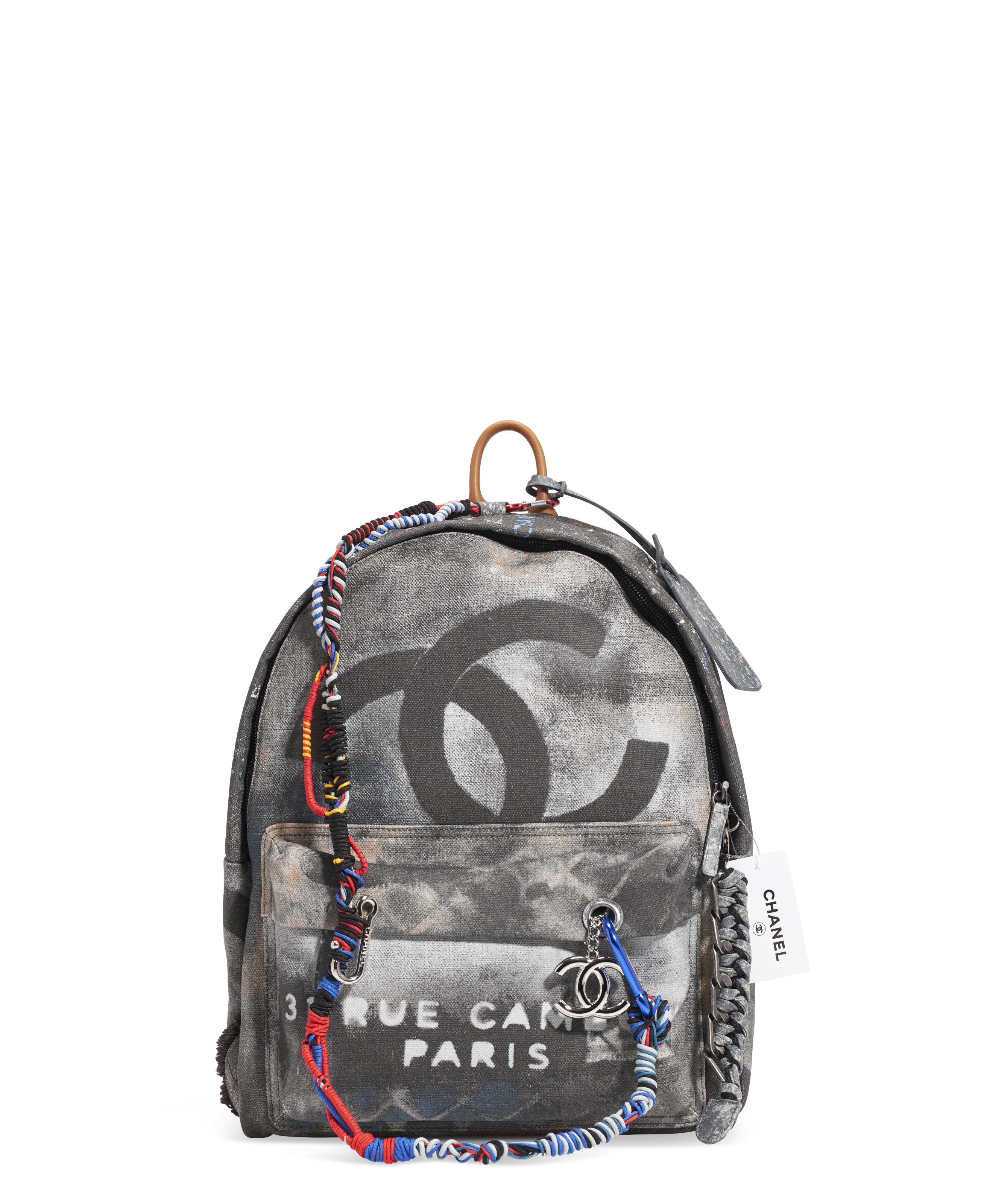 A BLACK CANVAS GRAFFITI BACKPACK WITH SILVER HARDWARE CHANEL