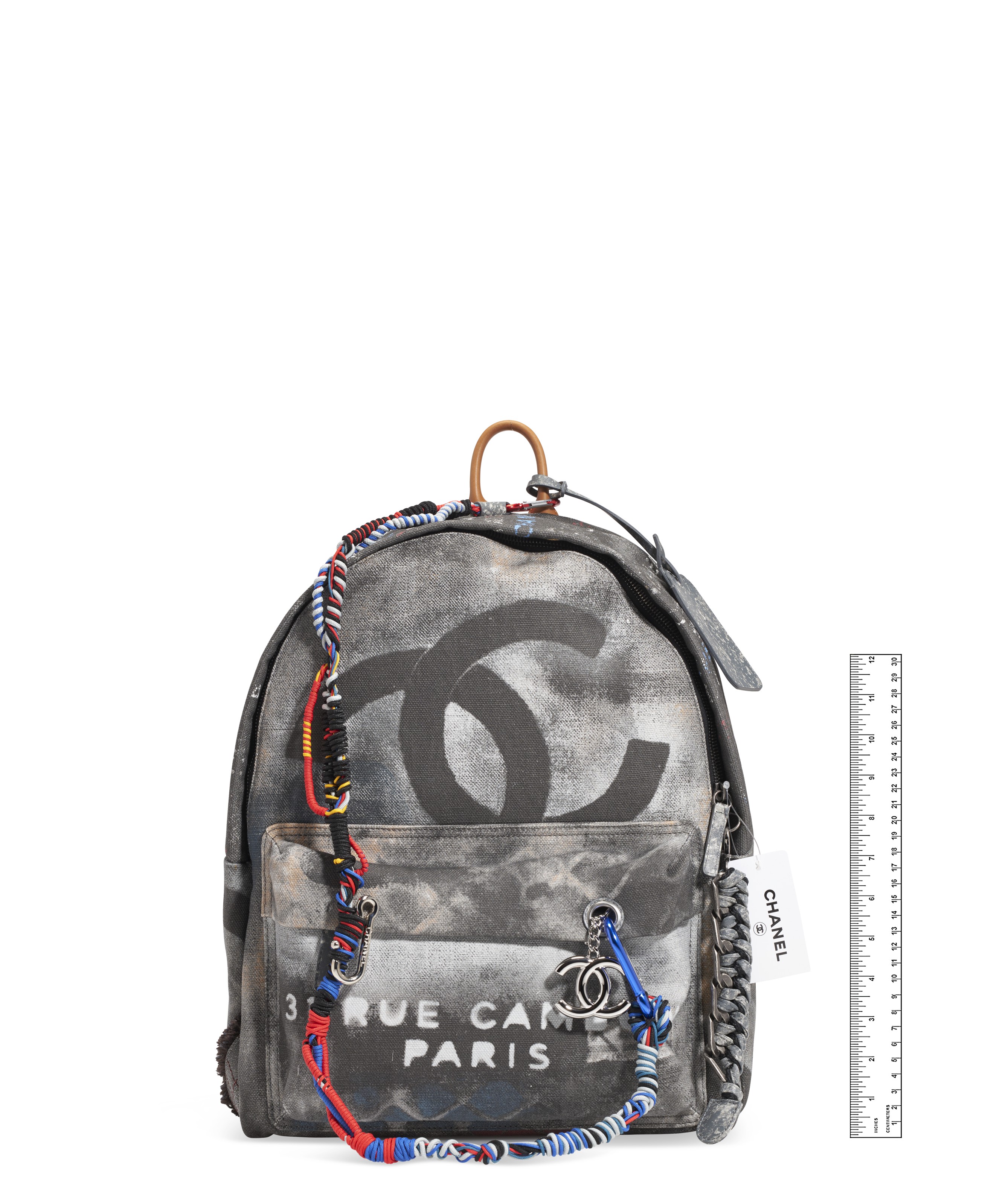 A BLACK CANVAS GRAFFITI BACKPACK WITH SILVER HARDWARE, CHANEL