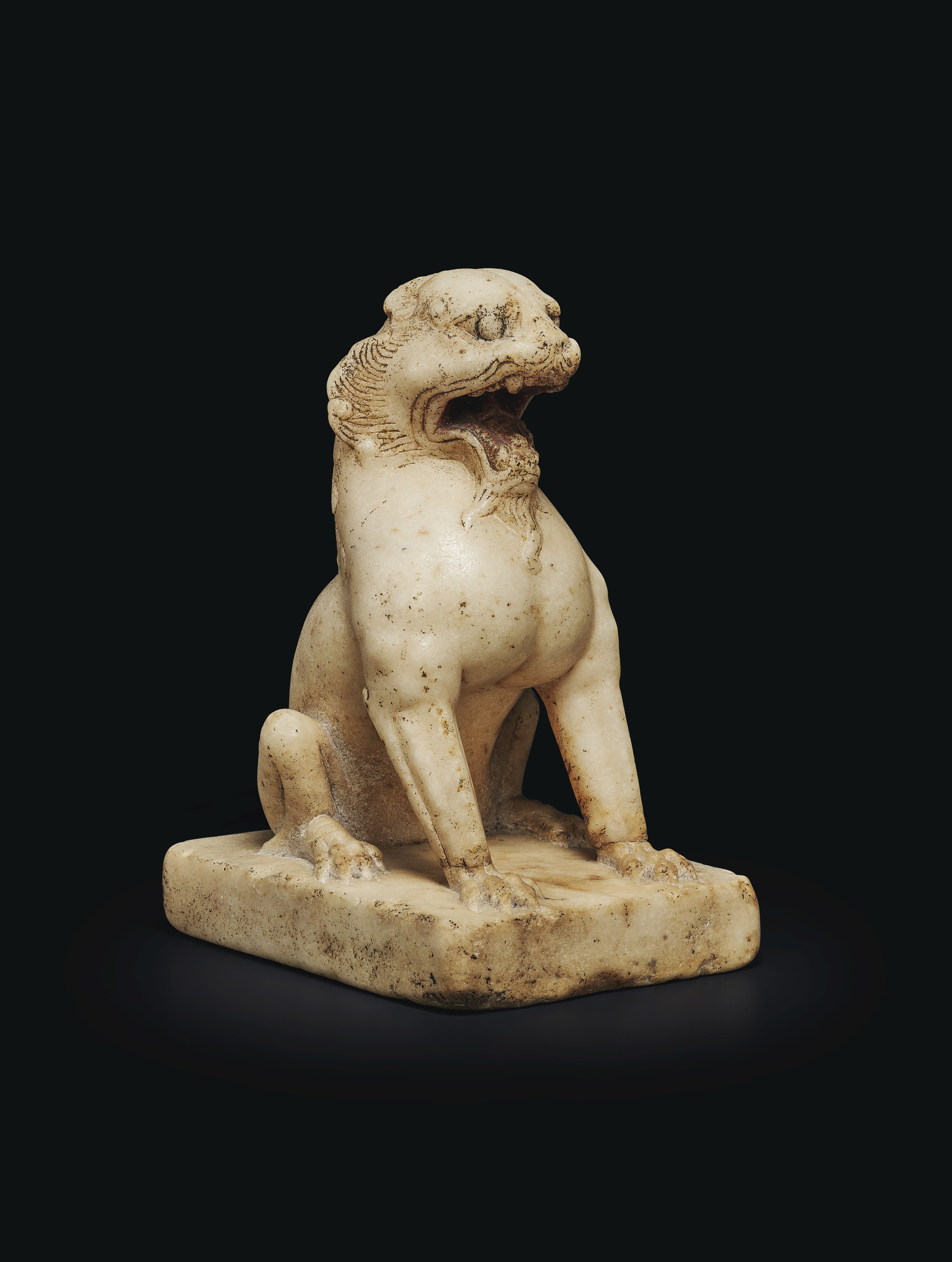A SMALL WHITE MARBLE FIGURE OF A SEATED LION , CHINA, TANG DYNASTY (AD