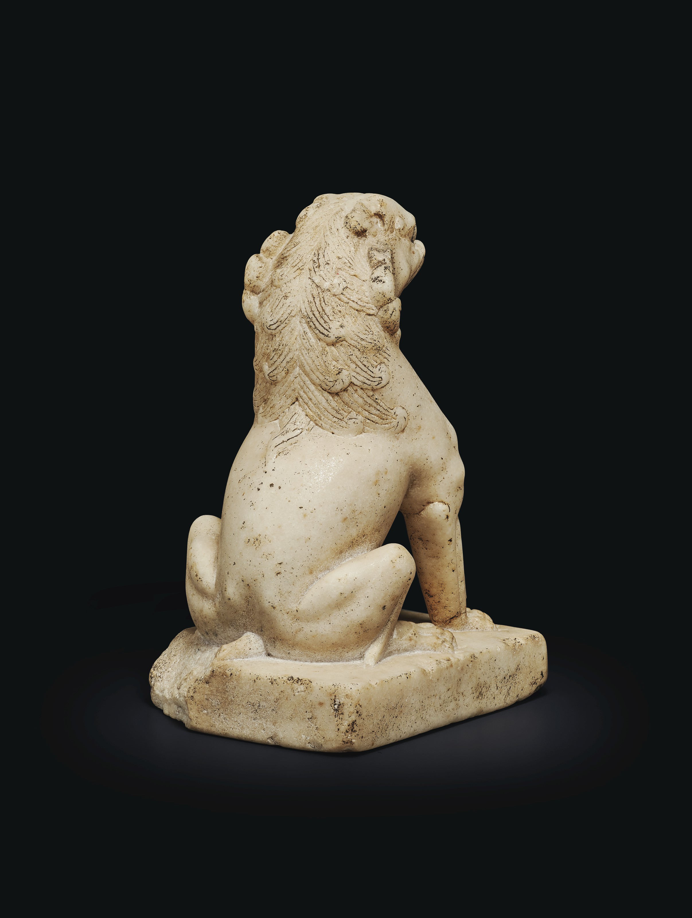 A SMALL WHITE MARBLE FIGURE OF A SEATED LION , CHINA, TANG DYNASTY (AD