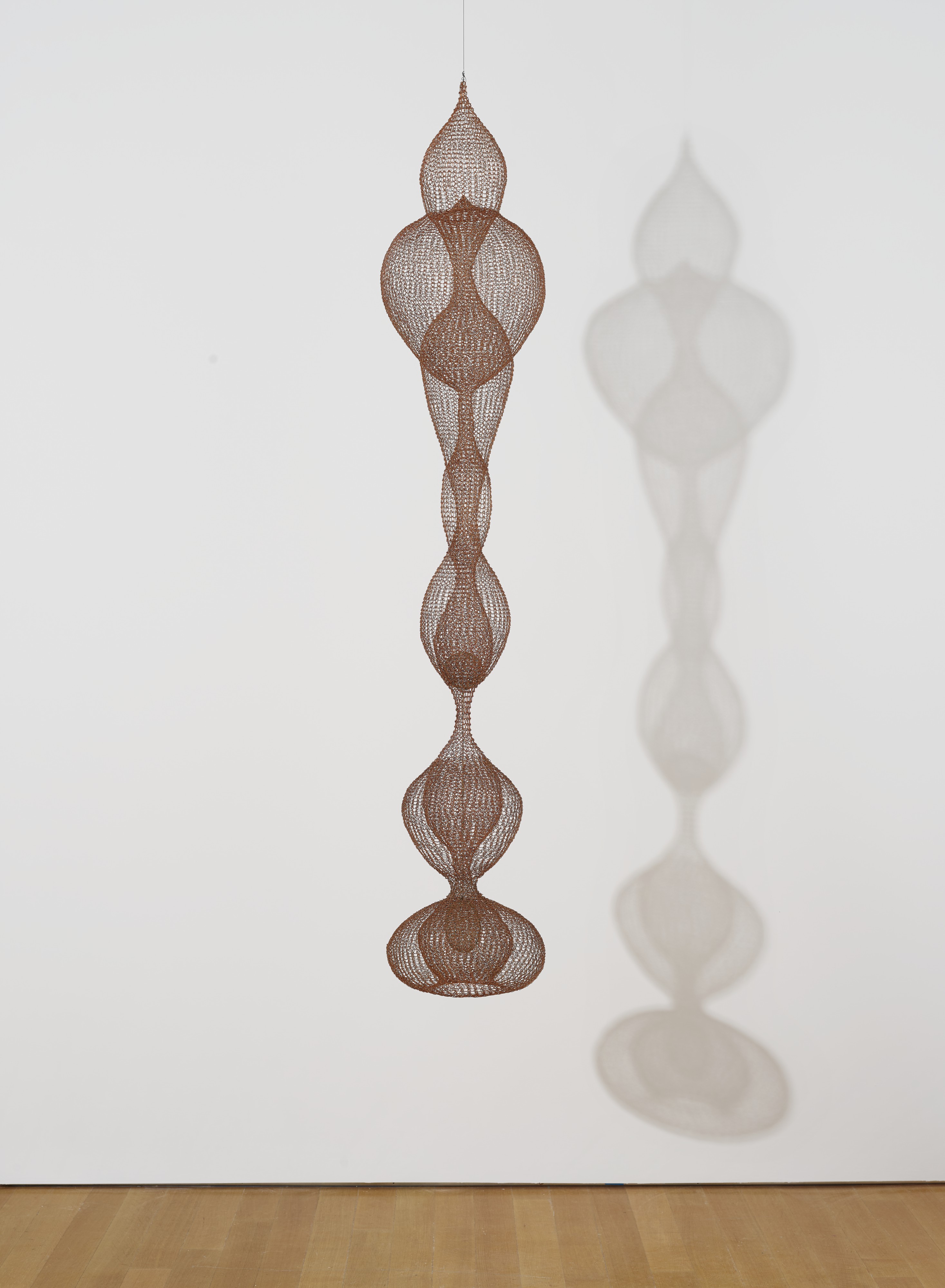 Ruth Asawa (1926-2013), Untitled (S.401, Hanging Seven-Lobed, Continuous Interlocking Form, with Spheres within Two Lobes), circa 1953-1954. Hanging sculpture &mdash; enamelled copper and brass wire.&nbsp;78 x 15 x 15  in (198.1 x 38.1 x 38.1  cm). Sold for $5,382,500 in ONE: A Global Sale of the 20th Century on 10 July 2020 at Christie&rsquo;s in New York.&copy; The Estate of Ruth Asawa / Artists Rights Society (ARS), New York