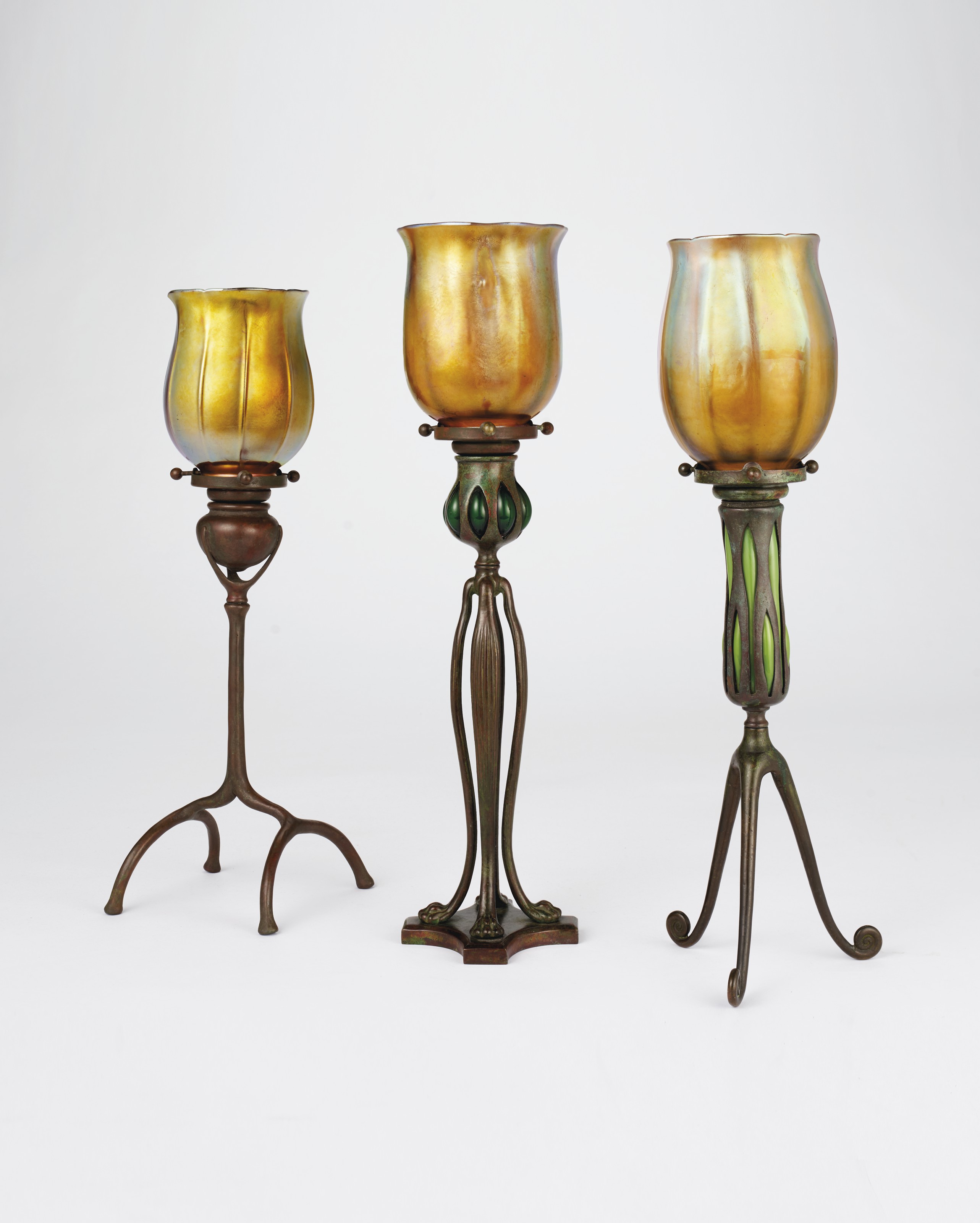TIFFANY STUDIOS , THREE CANDLESTICKS, CIRCA 1910 Christie's