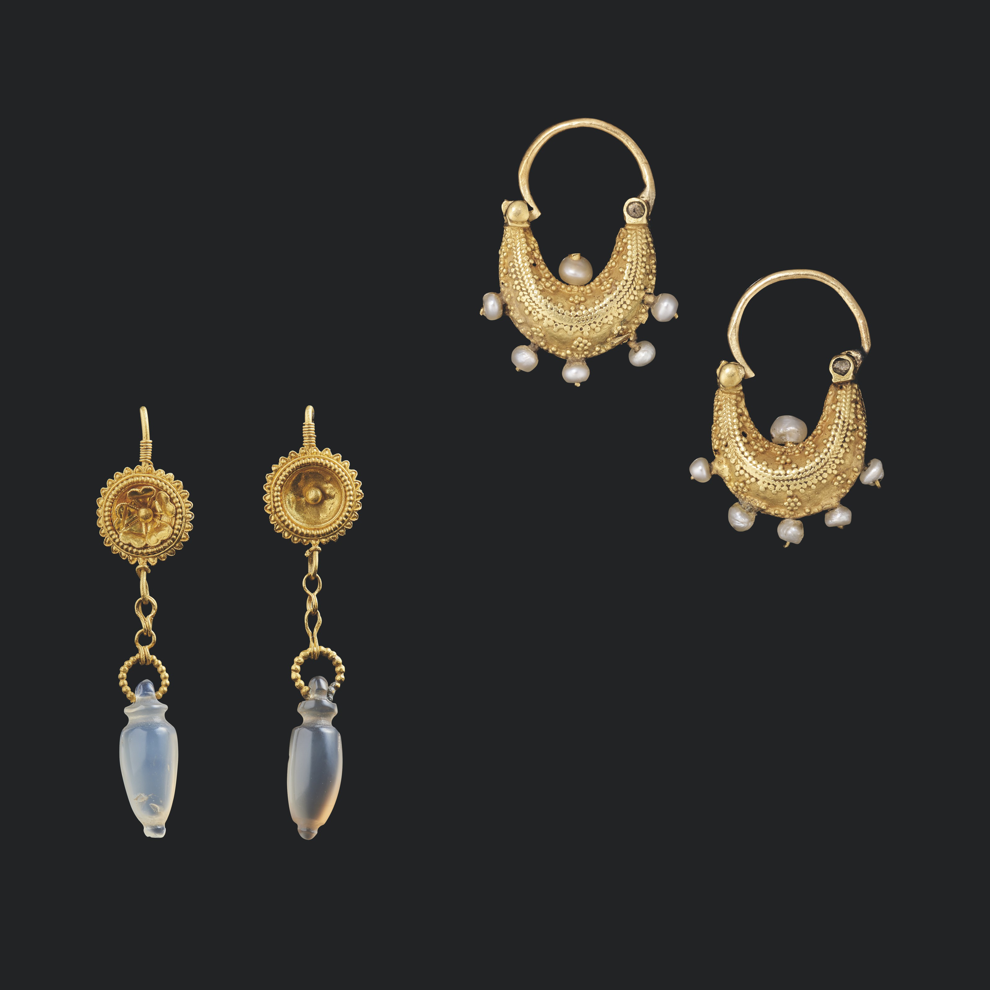 Two pairs of Greek and Roman gold earrings, circa 2nd century BC-2nd century AD. 2 in (5 cm) long. Sold for £10,625 on 8 December 2021 at Christie’s in London