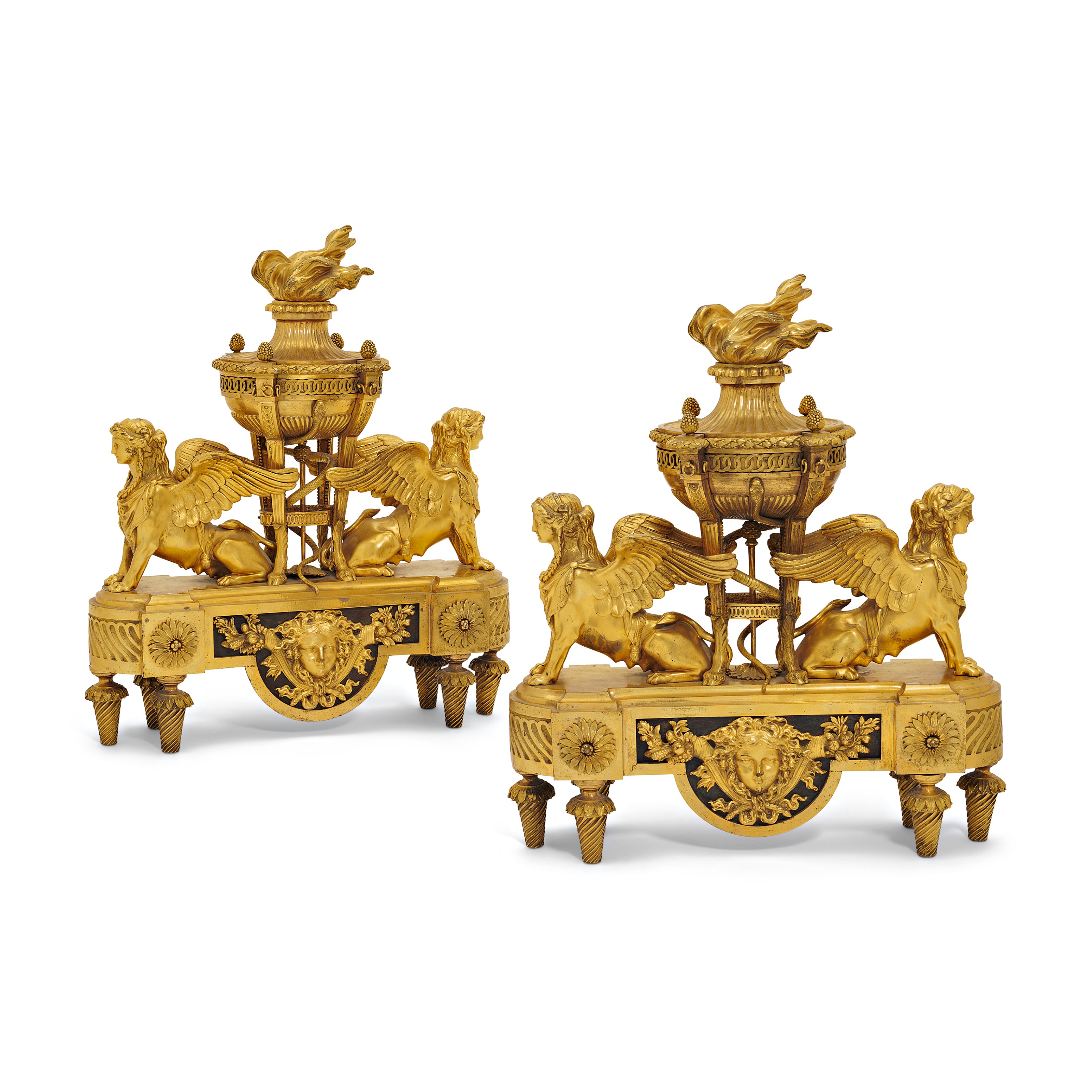 A PAIR OF LOUIS XVIII ORMOLU CHENETS, CIRCA 1815, AFTER A DESIGN