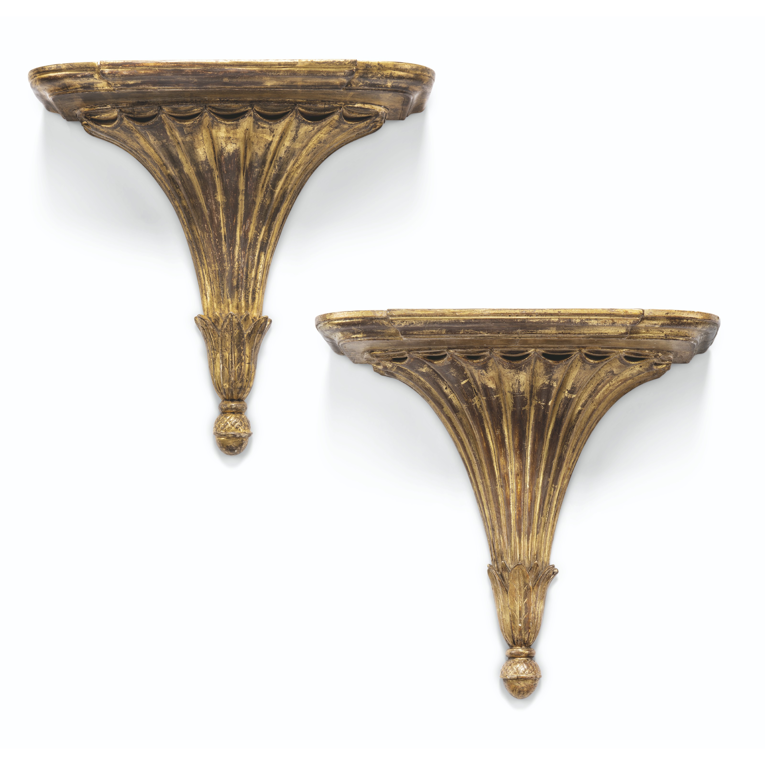 A MATCHED PAIR OF ENGLISH GILTWOOD FLUTED WALLBRACKETS, ONE III