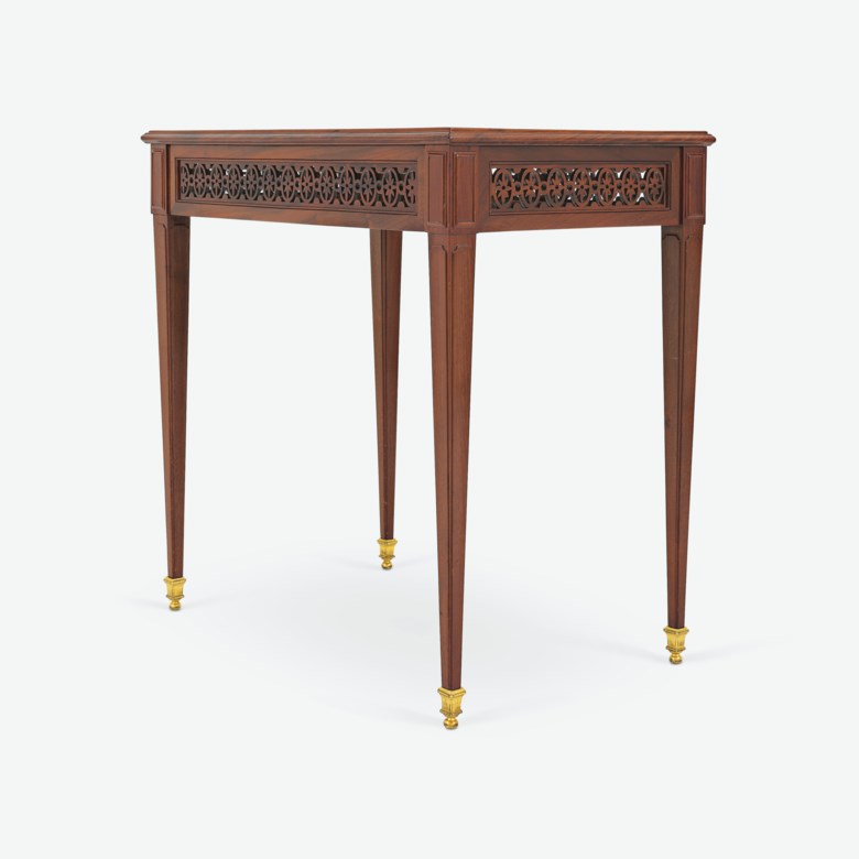 A Louis XVI ormolu-mounted mahogany and ebony-inlaid table à écrire by Joseph Gengenbach, dit Canabas, late 18th century. 74 cm (29⅕ in) high; 73 cm (28 710 in) wide; 48.5 cm (19 110 in) deep. Price on request. Offered in Expanding Horizons From European Decorative to Contemporary Arts, until 10 August 2021, Christie’s private sale