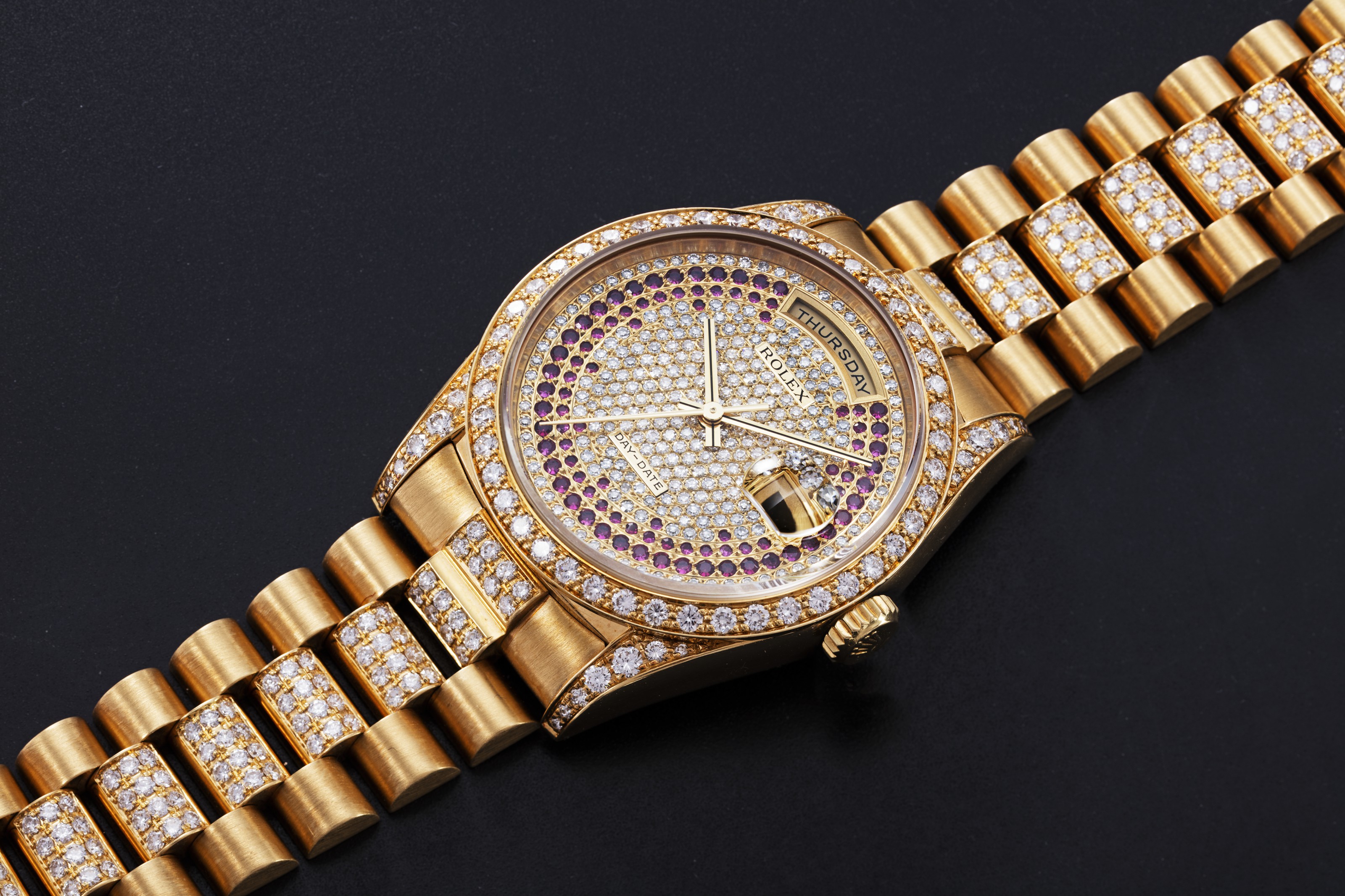 ROLEX, A GOLD OYSTER PERPETUAL DAYDATE WITH DIAMONDS AND RUBIES, REF