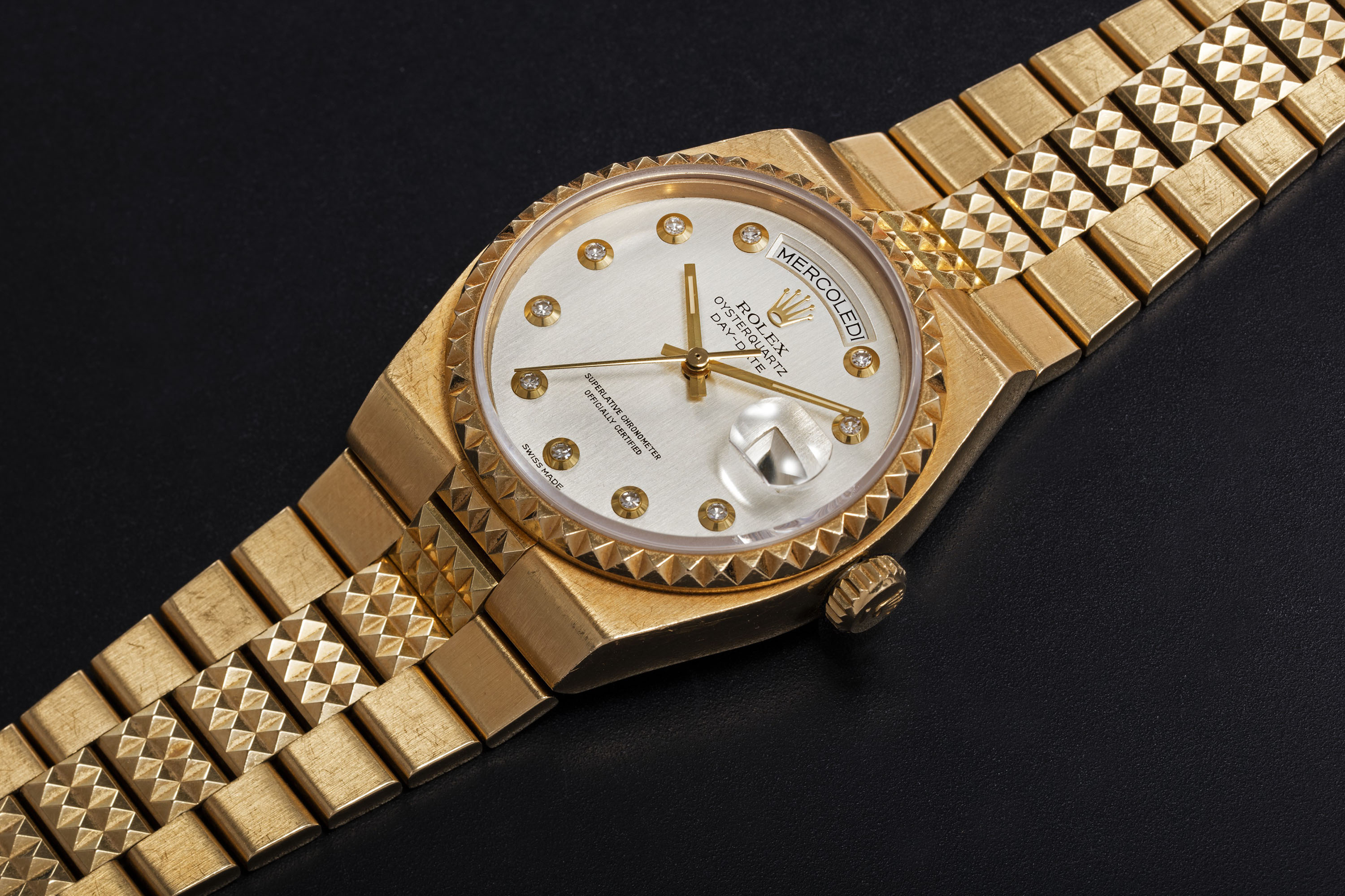 ROLEX A GOLD OYSTERQUARTZ DAY DATE PYRAMID REF. 19028