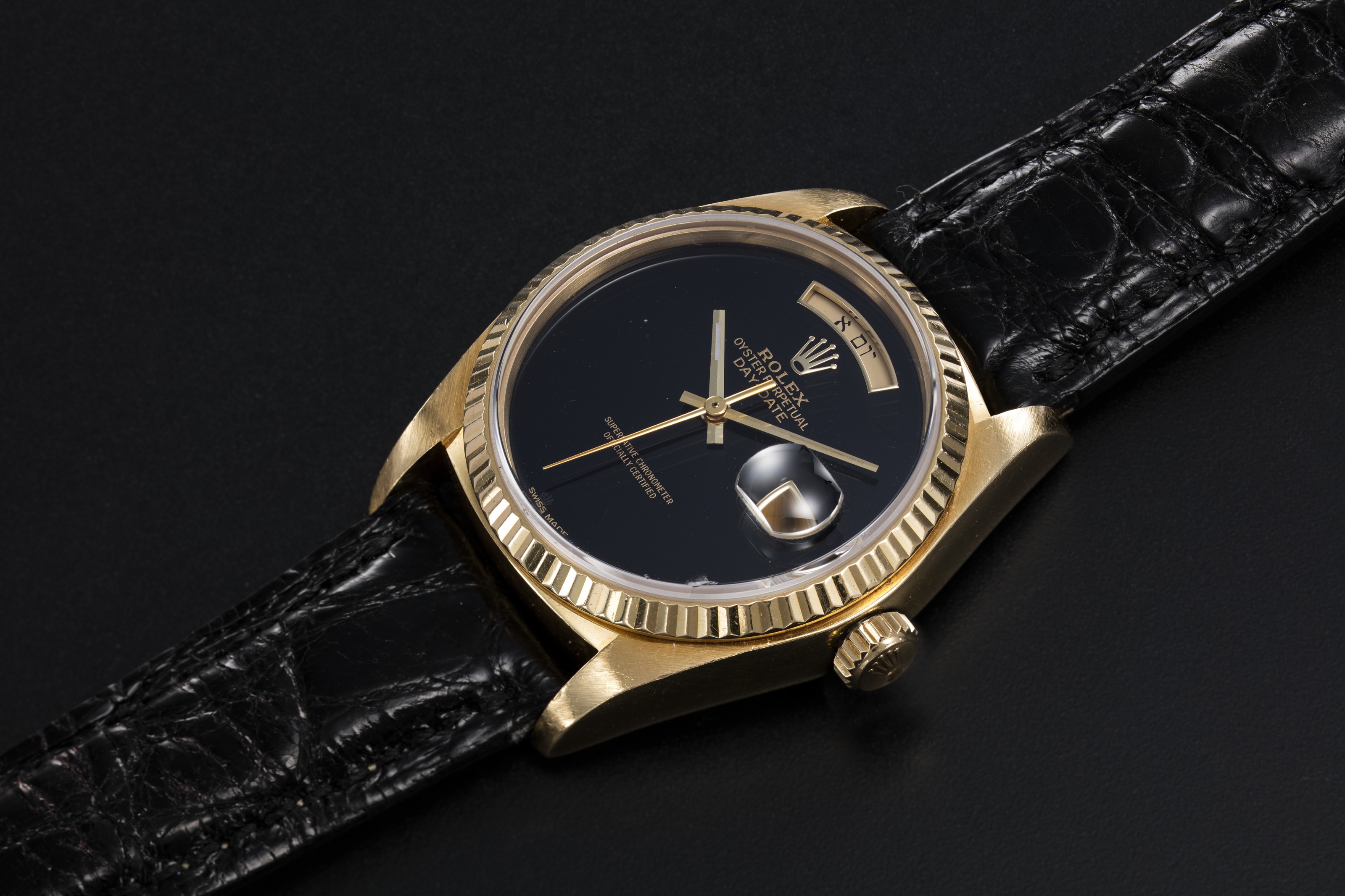 ROLEX A GOLD OYSTER PERPETUAL DAY DATE WITH ONYX DIAL AND HEBREW Barnebys
