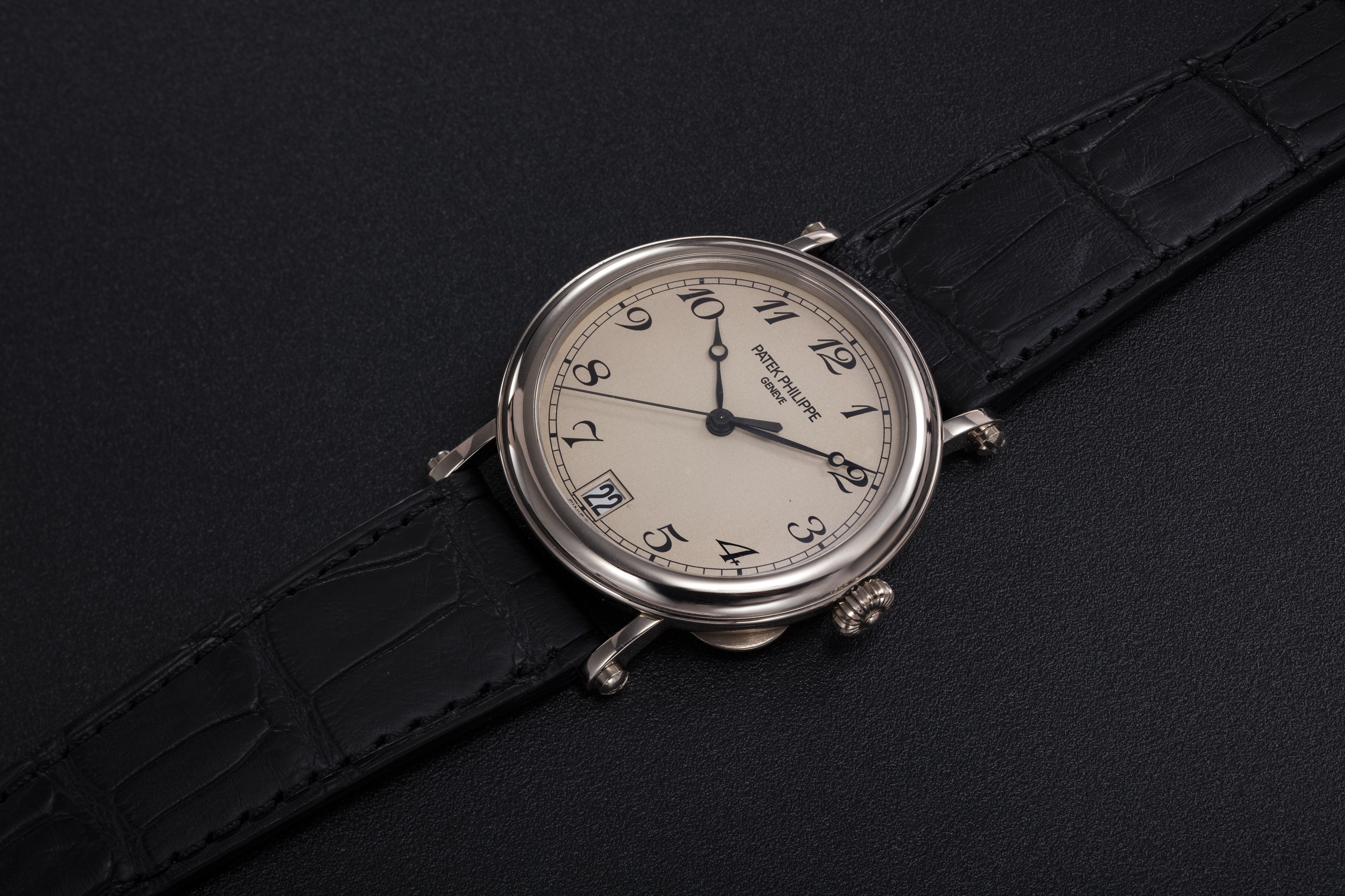 PATEK PHILIPPE A GOLD CALATRAVA WRISTWATCH WITH OFFICER S CASEBACK REF. 5053G 001