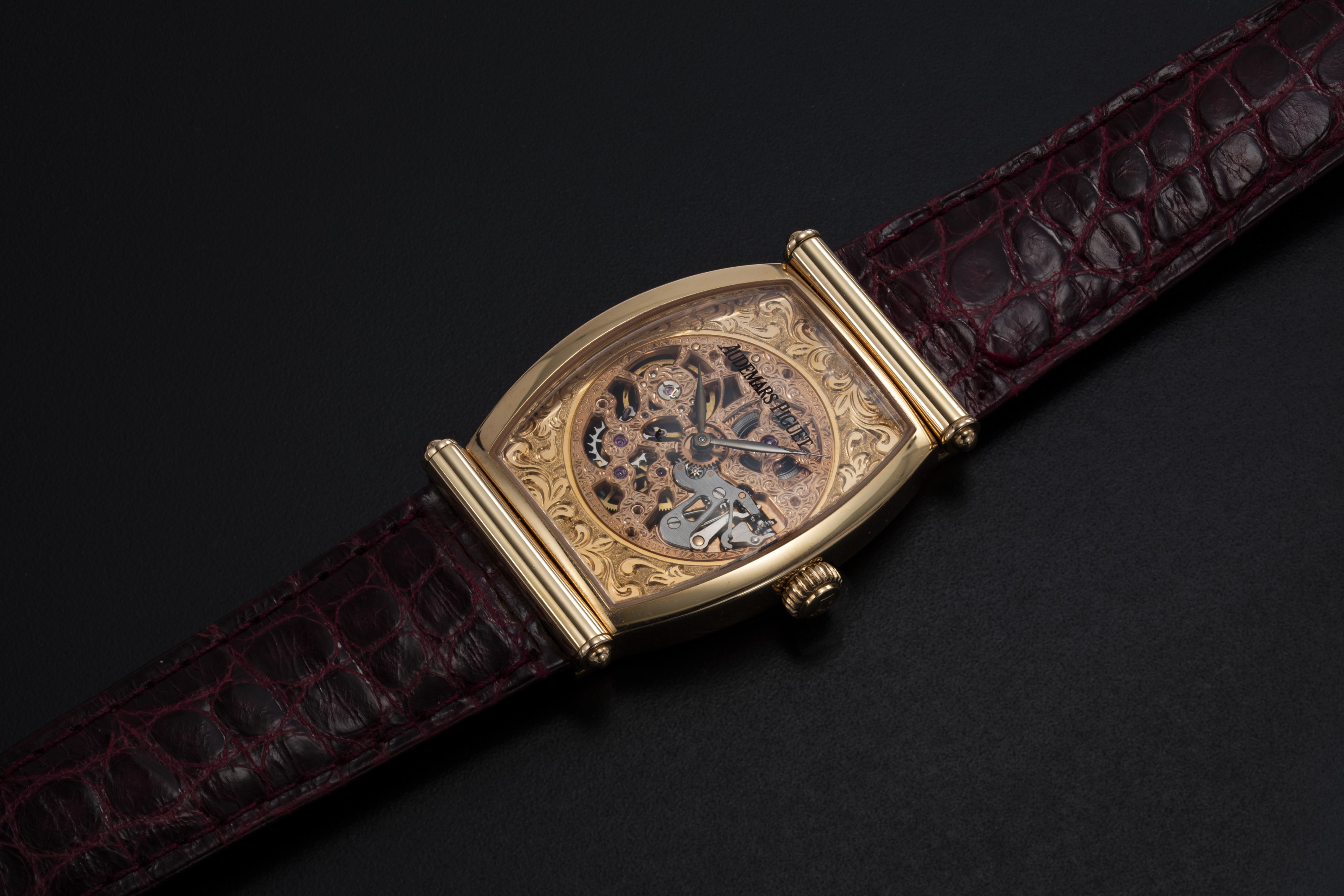 AUDEMARS PIGUET, A GOLD TONNEAU-SHAPED SKELETONISED WRISTWATCH