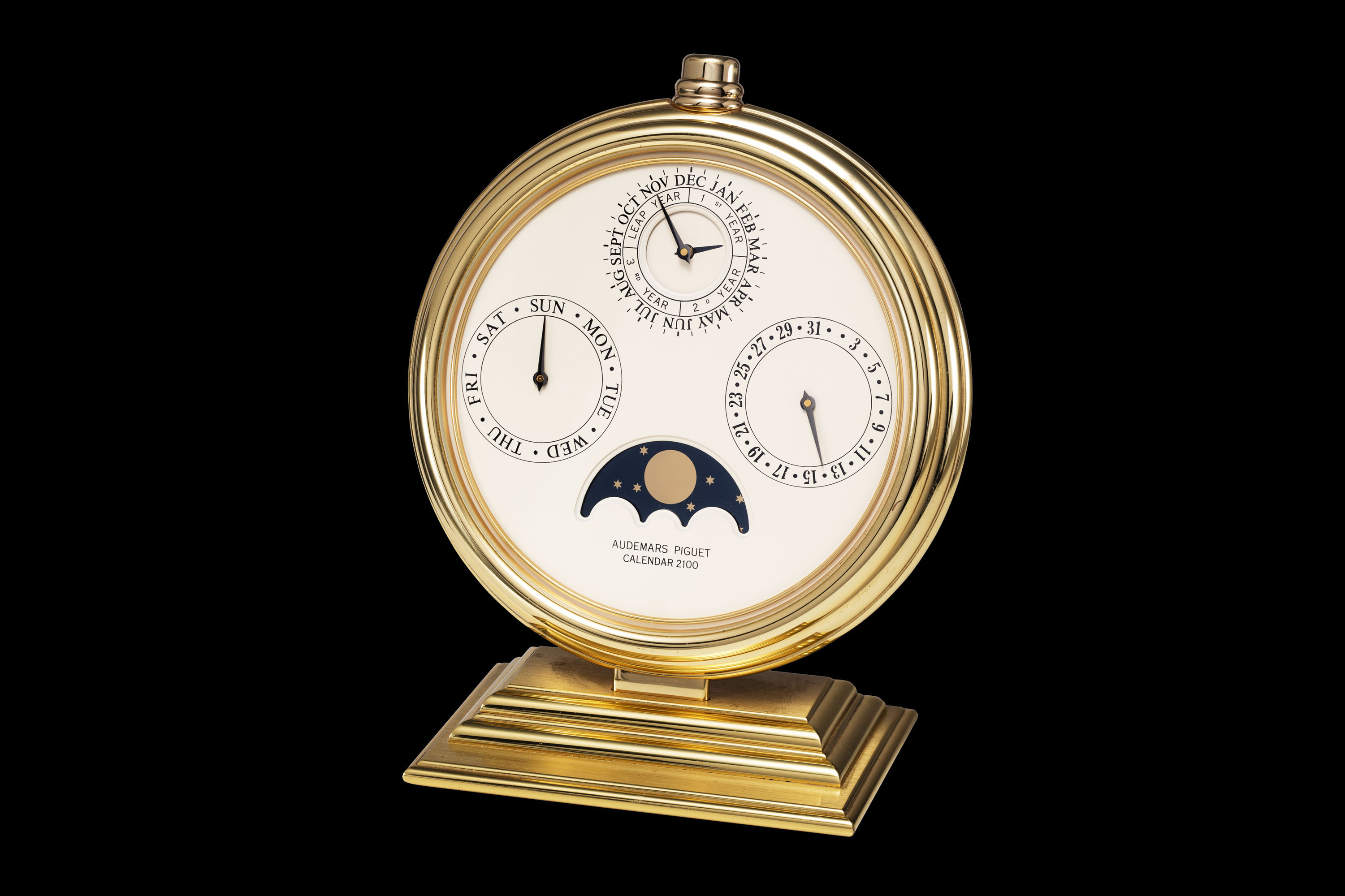 AUDEMARS PIGUET A GILT BRASS PERPETUAL CALENDAR 2100 DESK CLOCK