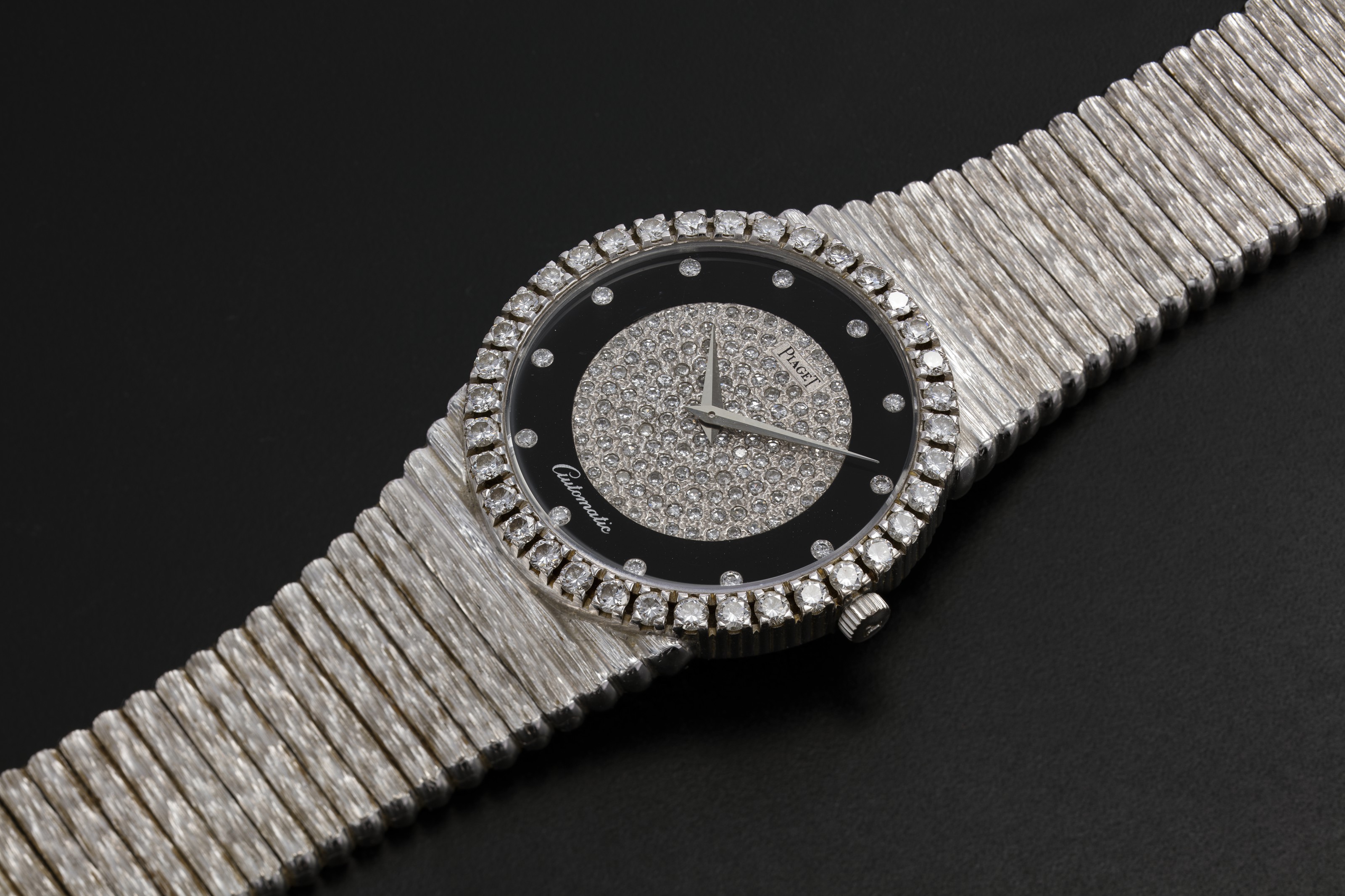 PIAGET, A GOLD SLIM DRESS WATCH WITH ONYX DIAL AND DIAMOND-CRUSTED