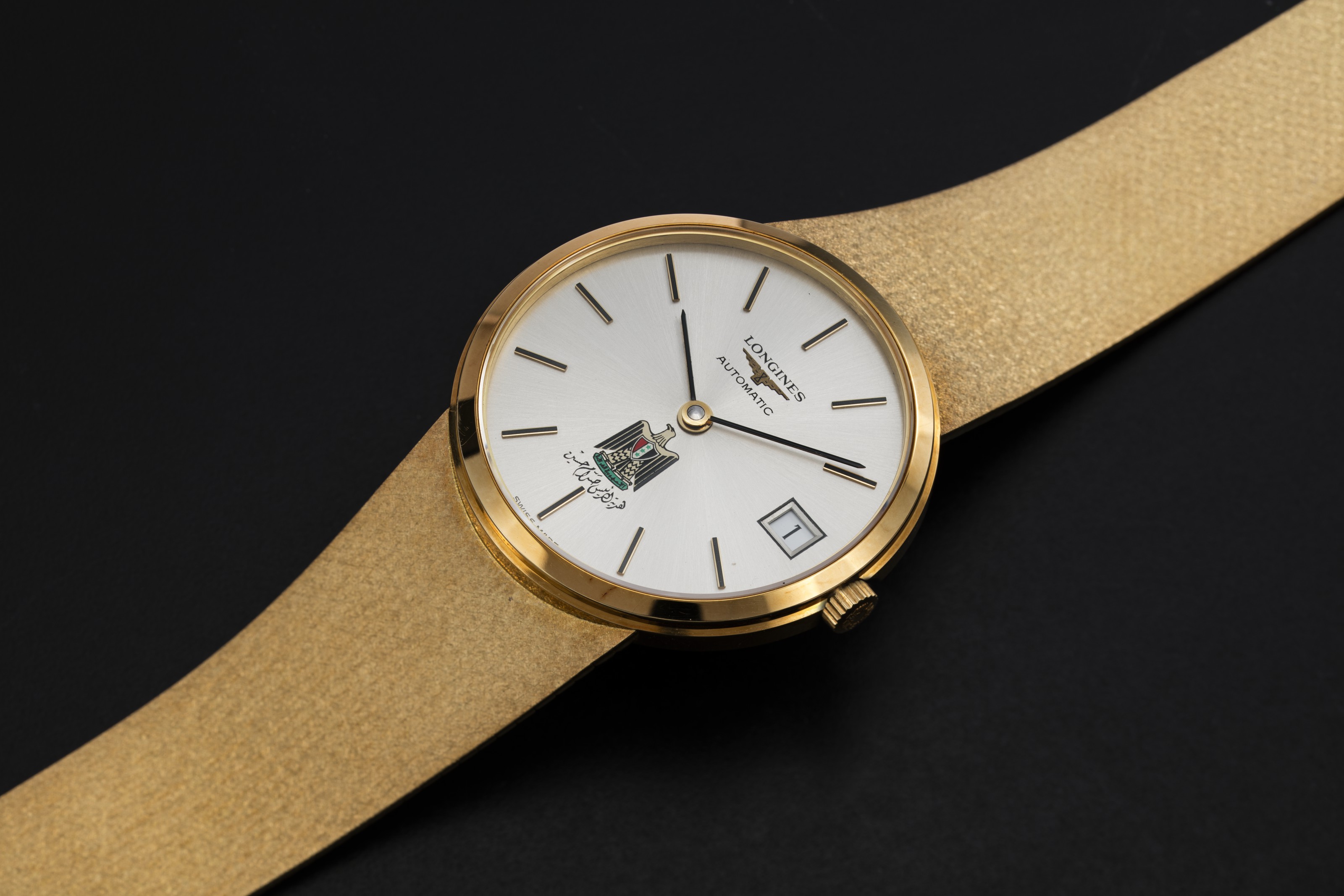 LONGINES, AN ELEGANT GOLD DRESS WATCH WITH THE IRAQI COAT-OF-ARMS, CASE  NUMBER: 18'674'078, MOVEMENT NUMBER: 53'952'183 | Christie's