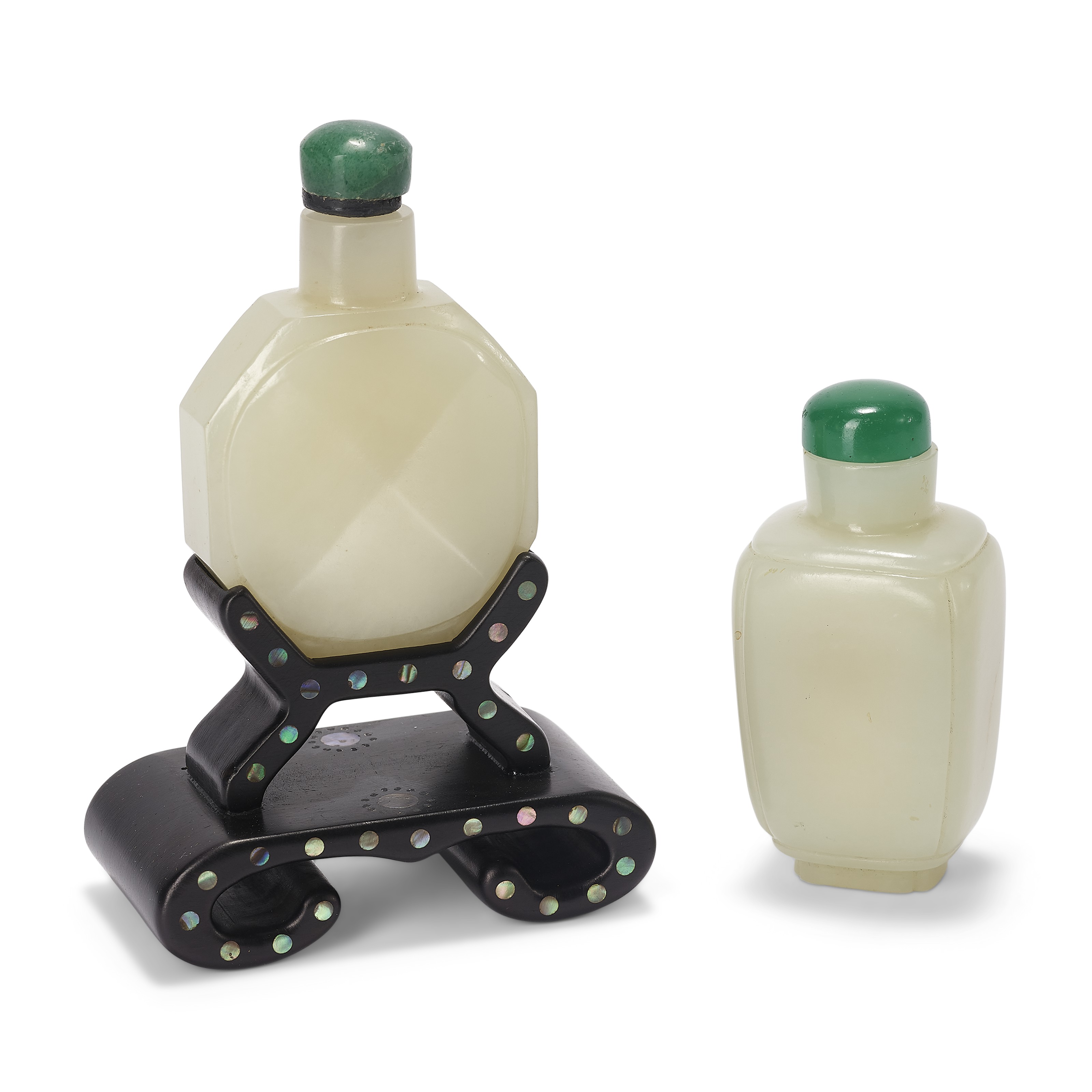 A greenish-white jade octagonal snuff bottle and a greenish-white jade rectangular snuff bottle. The larger, 2&frac12; in (5.7 cm) high.