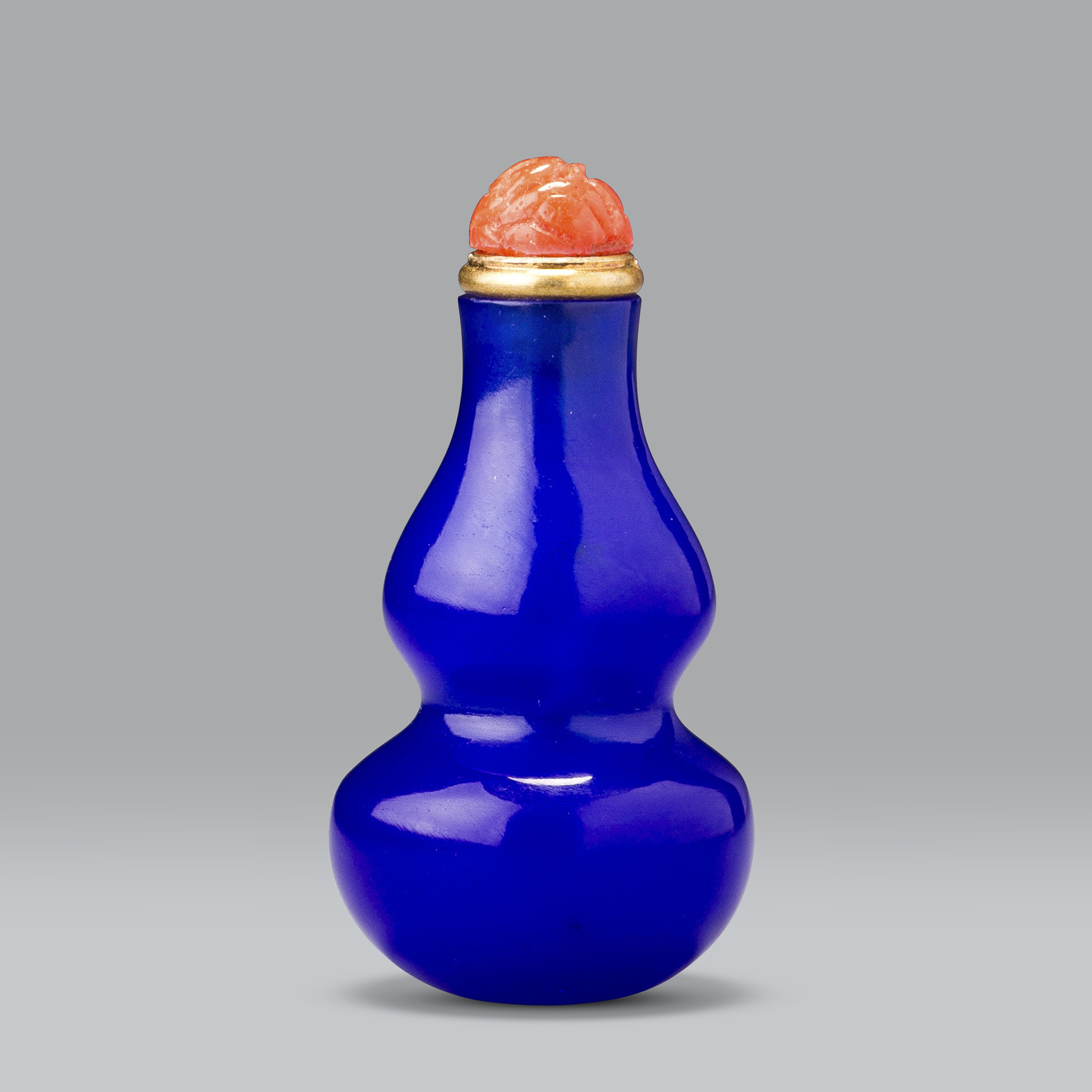 AN UNDERGLAZE-BLUE AND COPPER-RED PORCELAIN 'EIGHT BUDDHIST