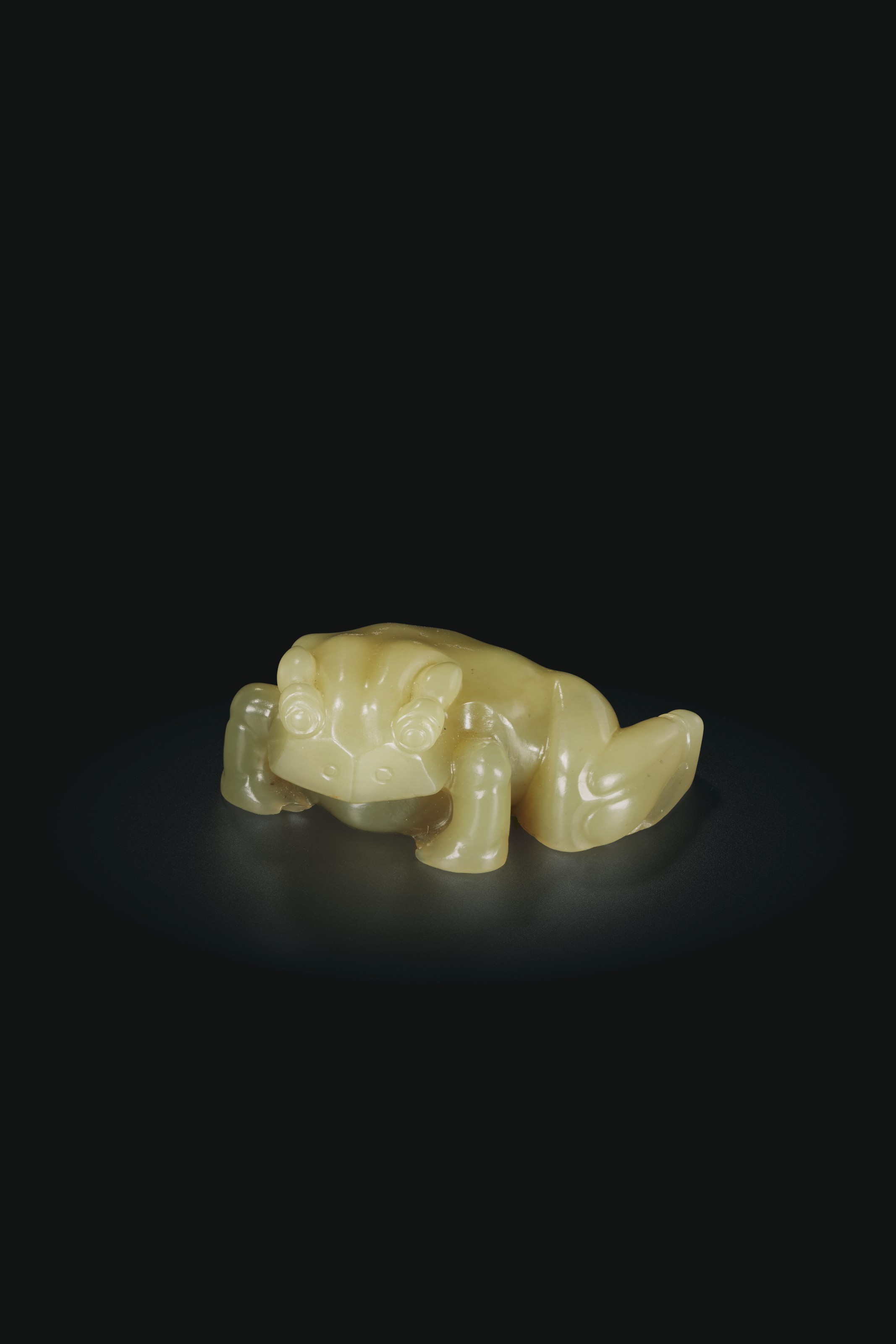 A FINELY CARVED WHITE JADE FIGURE OF A MYTHICAL BEAST, 17TH-18TH