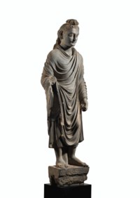 A MAGNIFICENT AND MONUMENTAL GRAY SCHIST FIGURE OF BUDDHA SHAKYAMUNI ...