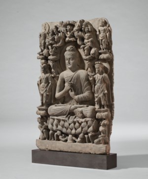A RARE GRAY SCHIST RELIEF TRIAD OF BUDDHA SHAKYAMUNI FLANKED BY ...