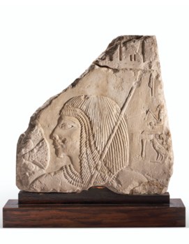 AN EGYPTIAN LIMESTONE RELIEF FRAGMENT