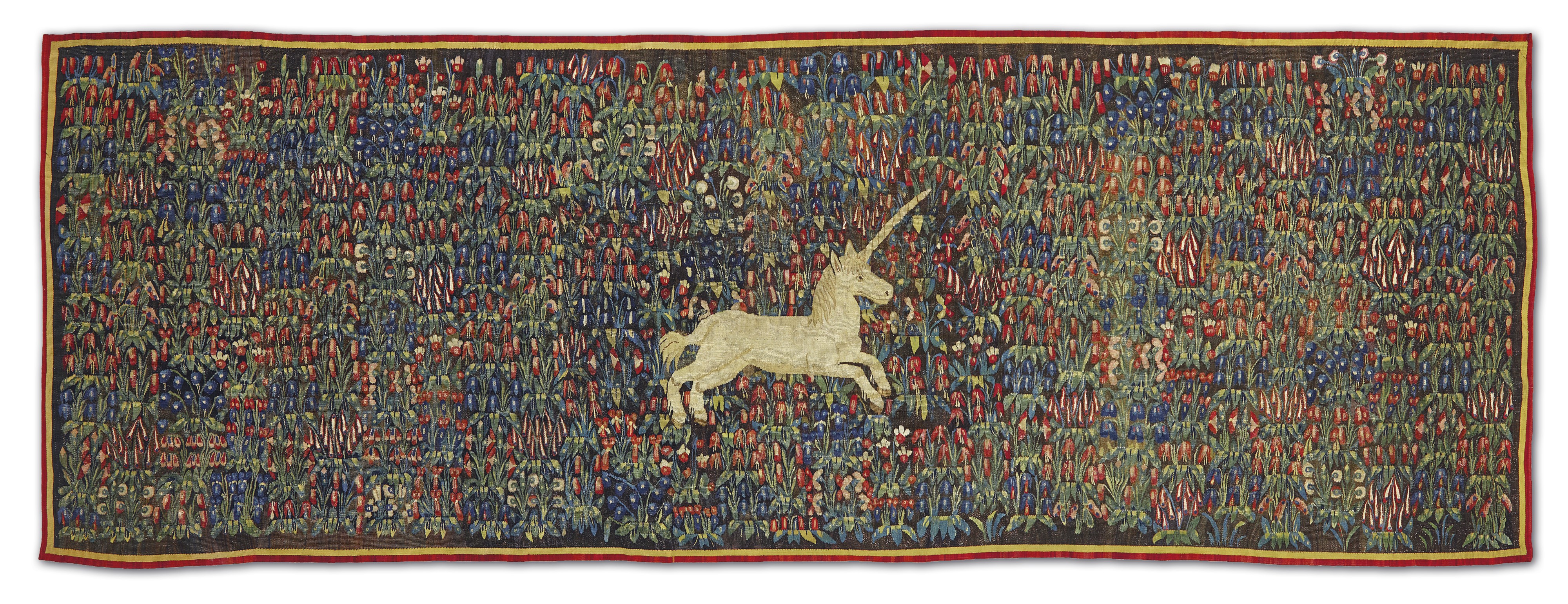 A Millefleurs Tapestry With A Unicorn In A Field Of Flowers