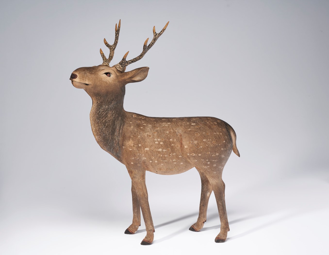 large wooden deer sculpture