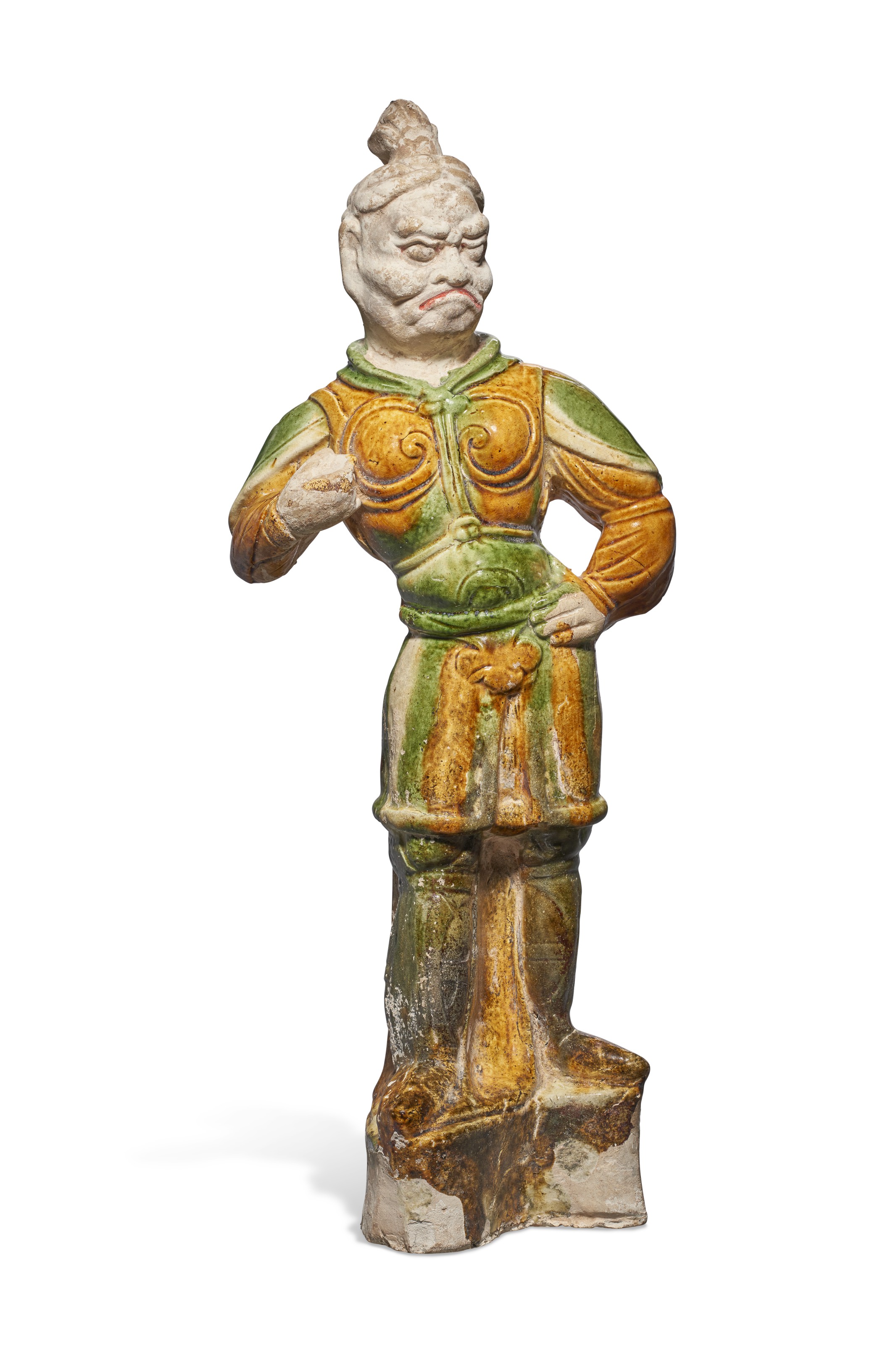 A SANCAI-GLAZED POTTERY FIGURE OF A GUARDIAN, CHINA, TANG DYNASTY