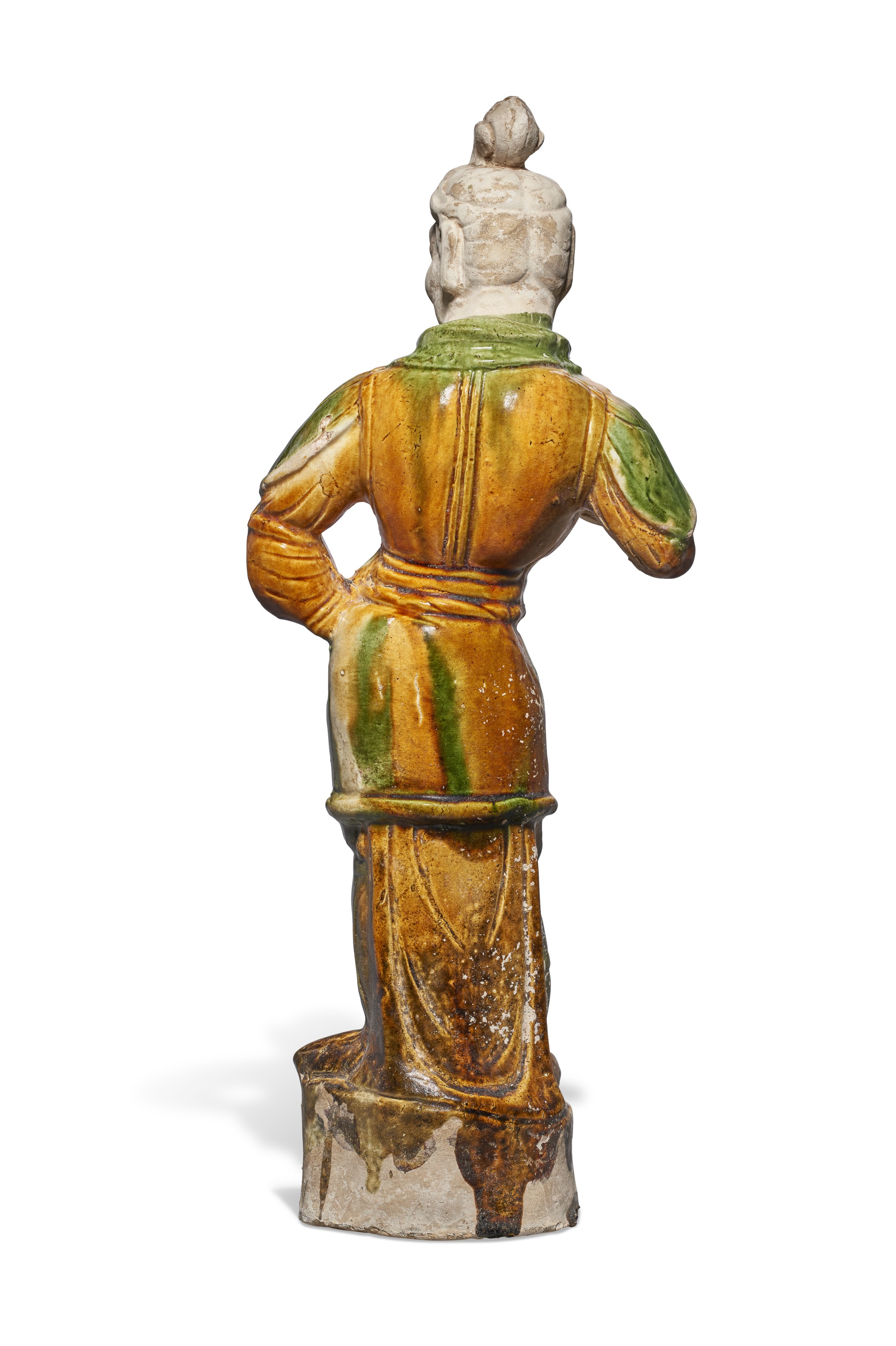 A SANCAI-GLAZED POTTERY FIGURE OF A GUARDIAN, CHINA, TANG DYNASTY