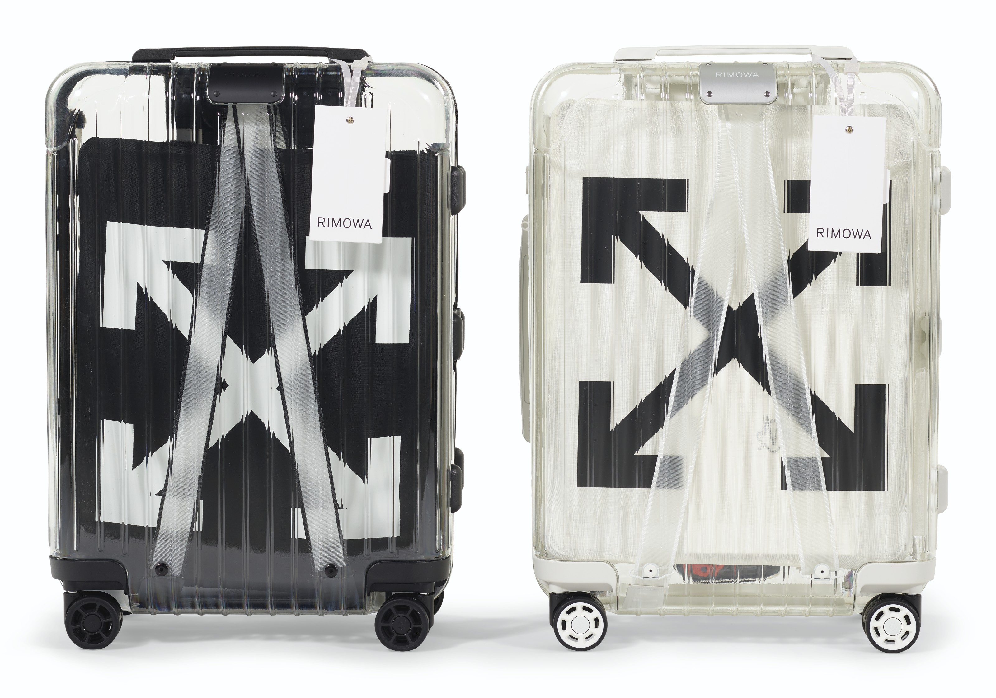 A PAIR OF BLACK WHITE TRANSPARENT CARRY ON SUITCASES RIMOWA X