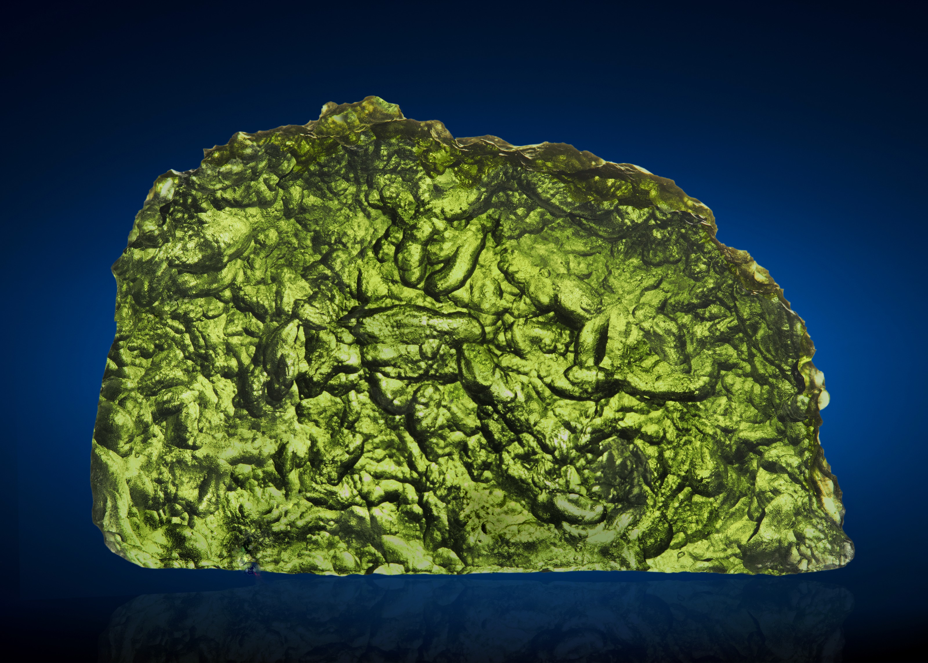 Moldavite &mdash; glass created when Earth and asteroid collide, Moldau River Valley, Czech Republic. 1.3 x 2 x 0.33 in (34 x 55 x 10mm) and 36.22g (181 carats). Sold for $17,500 on 23 February 2021 at Christie&rsquo;s Online