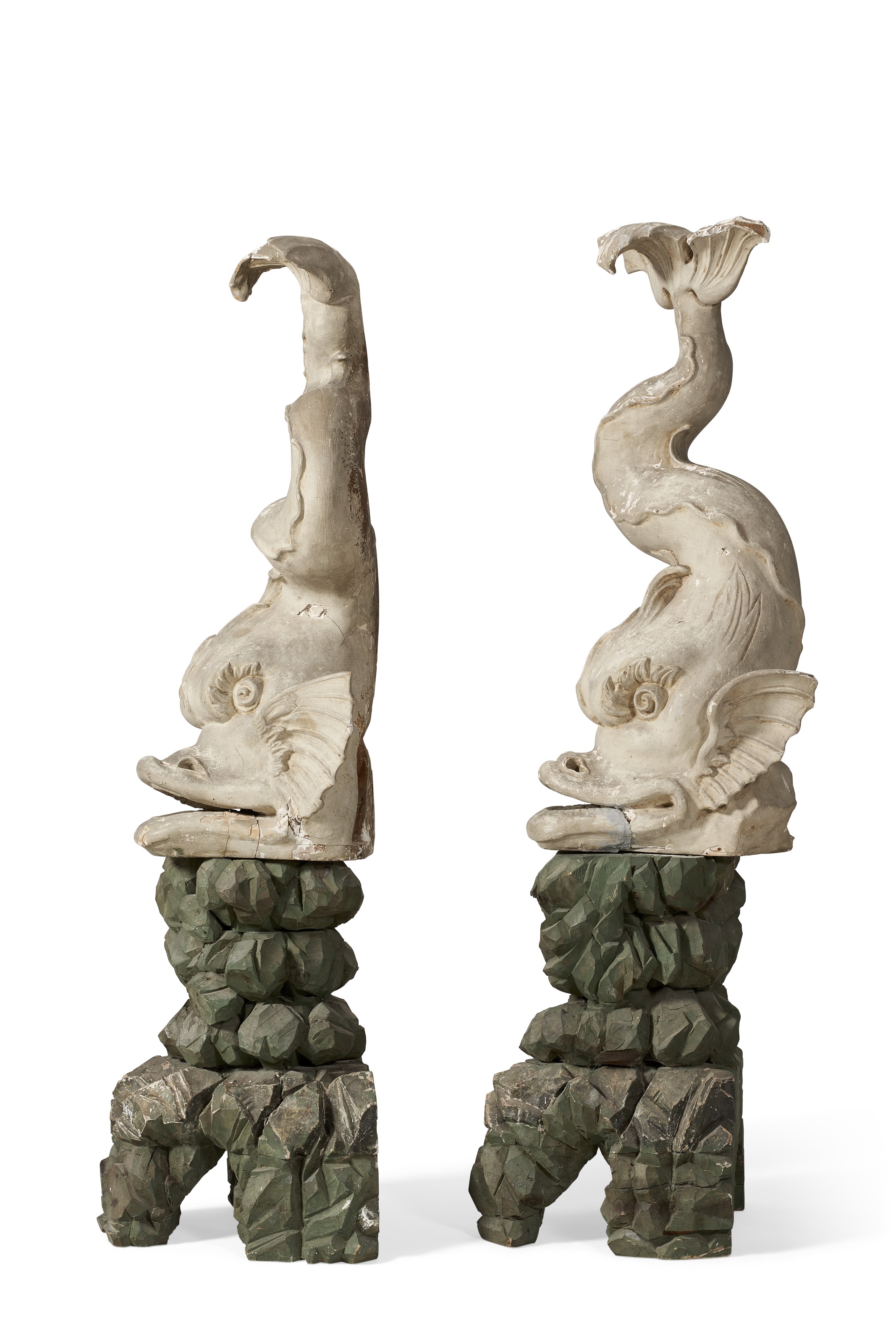 A PAIR OF NORTH ITALIAN PAINTED FIGURES OF DOLPHINS, PROBABLY