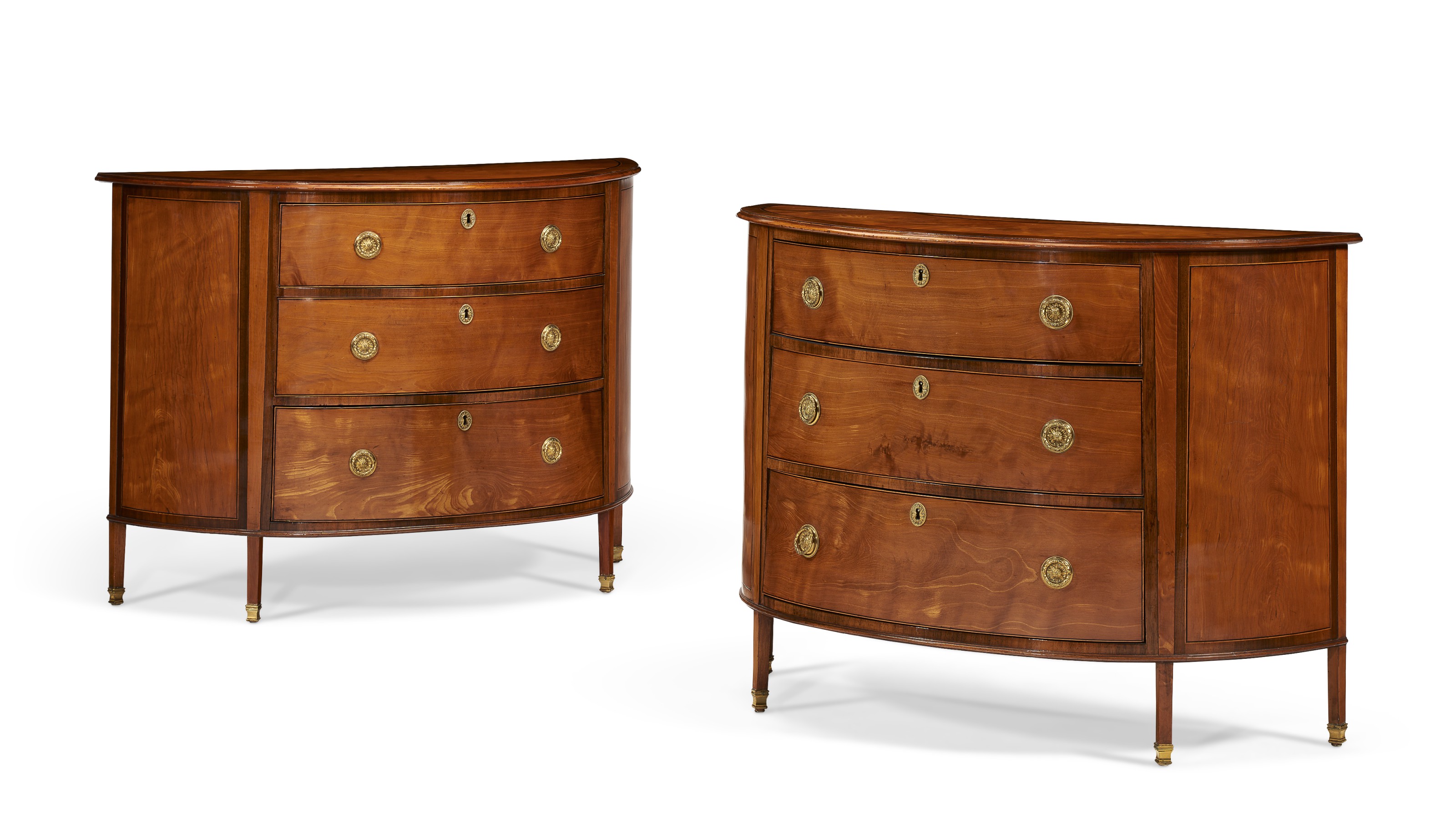 A near pair of George III inlaid satinwood commodes, c. 1780, attributed to Ince and Mayhew. Sold for $8,750 on 19 October 2021, Online