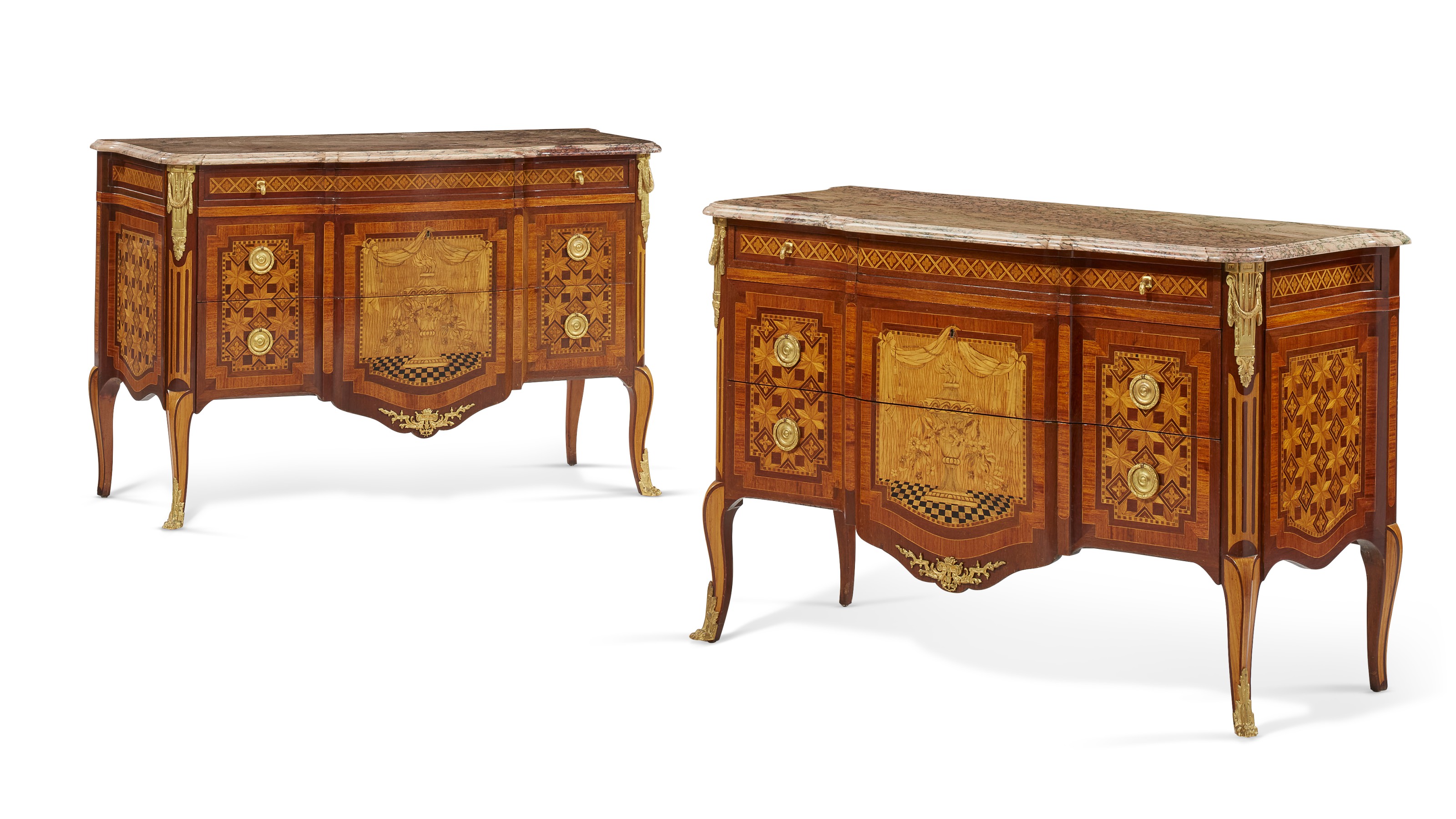 A pair of French ormolu-mounted mahogany, amaranth, fruitwood, marquetry and parquetry commodes, early 20th century. Sold for $18,750 on 19 October 2021, Online