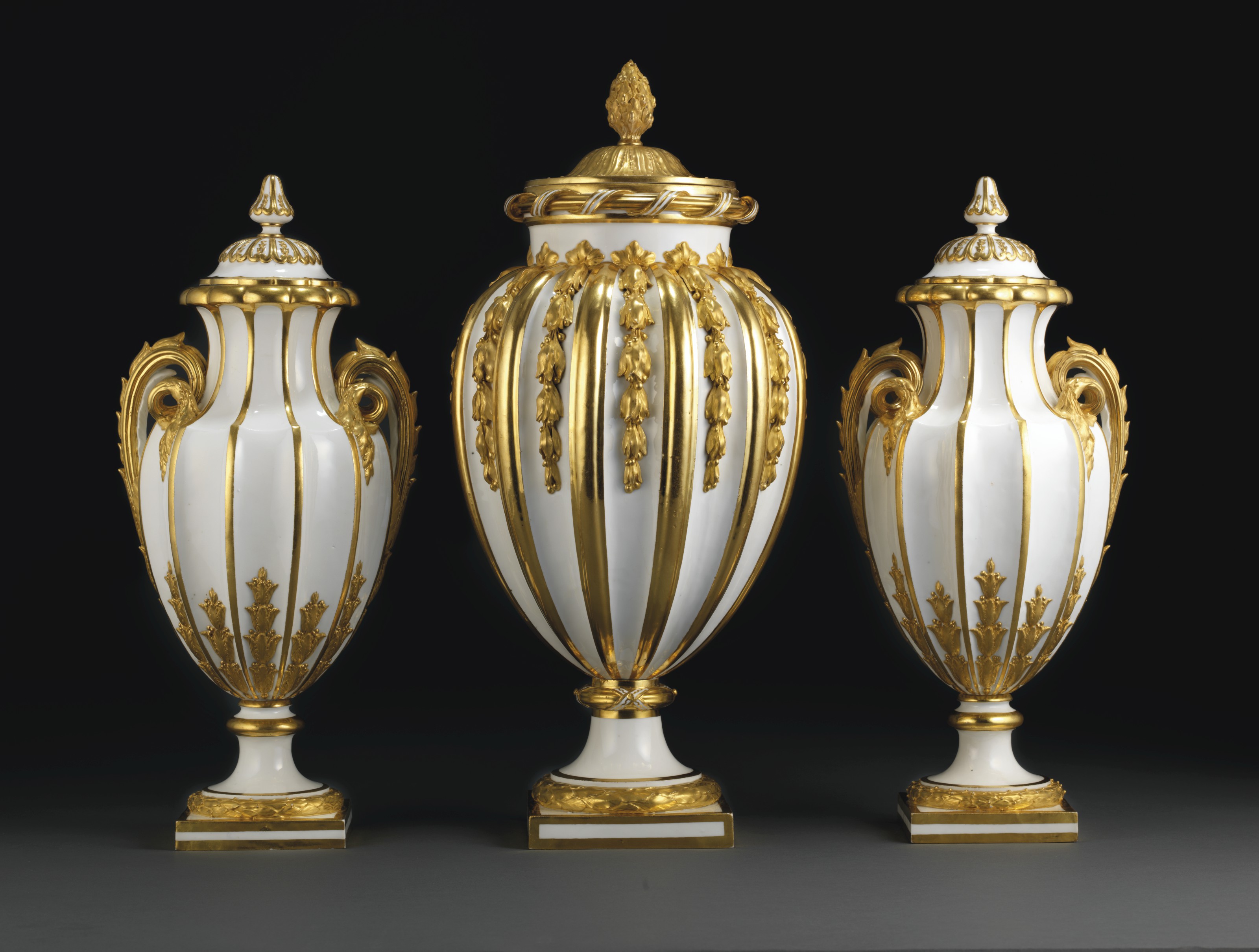 A SEVRES (HARD PASTE) PORCELAIN GARNITURE OF THREE GILT