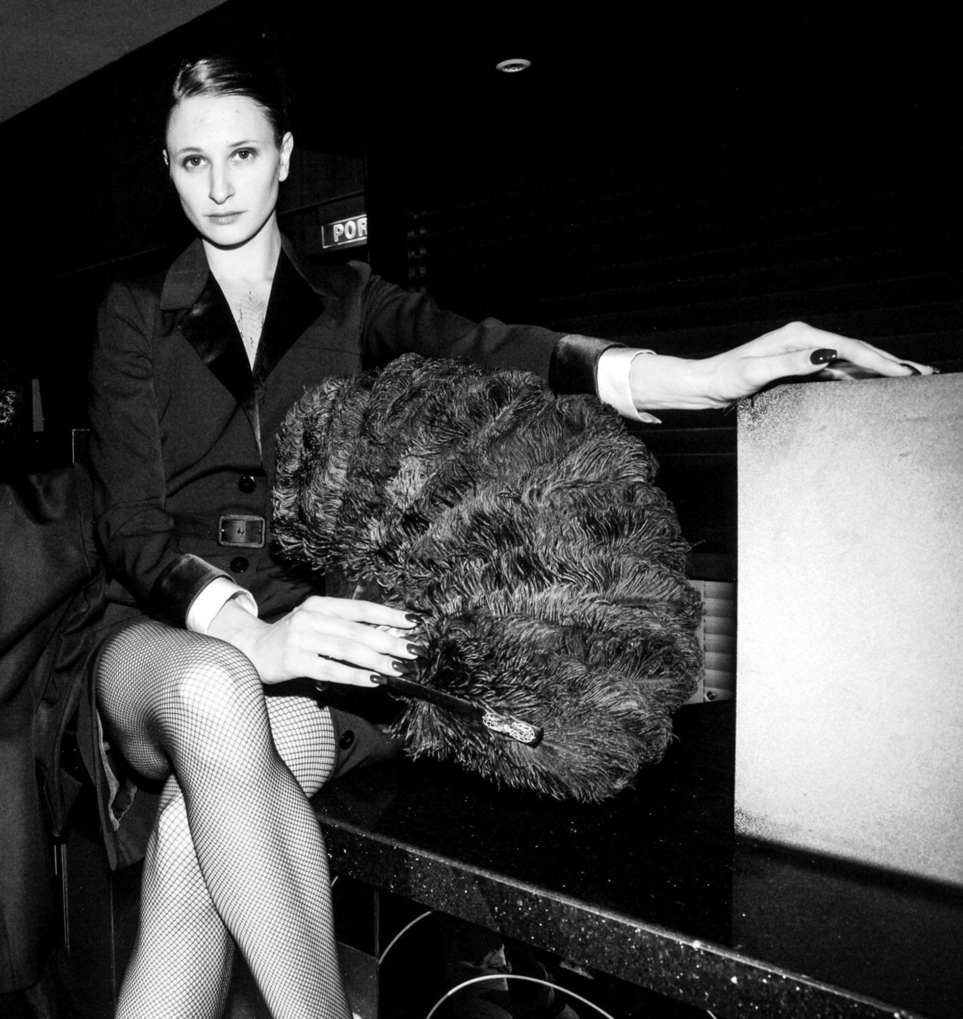 Yves Saint Laurent Haute Couture Spring/Summer 1981. Black tuxedo dress with white satin wrists and belt. Estimate: €1,000-2,000